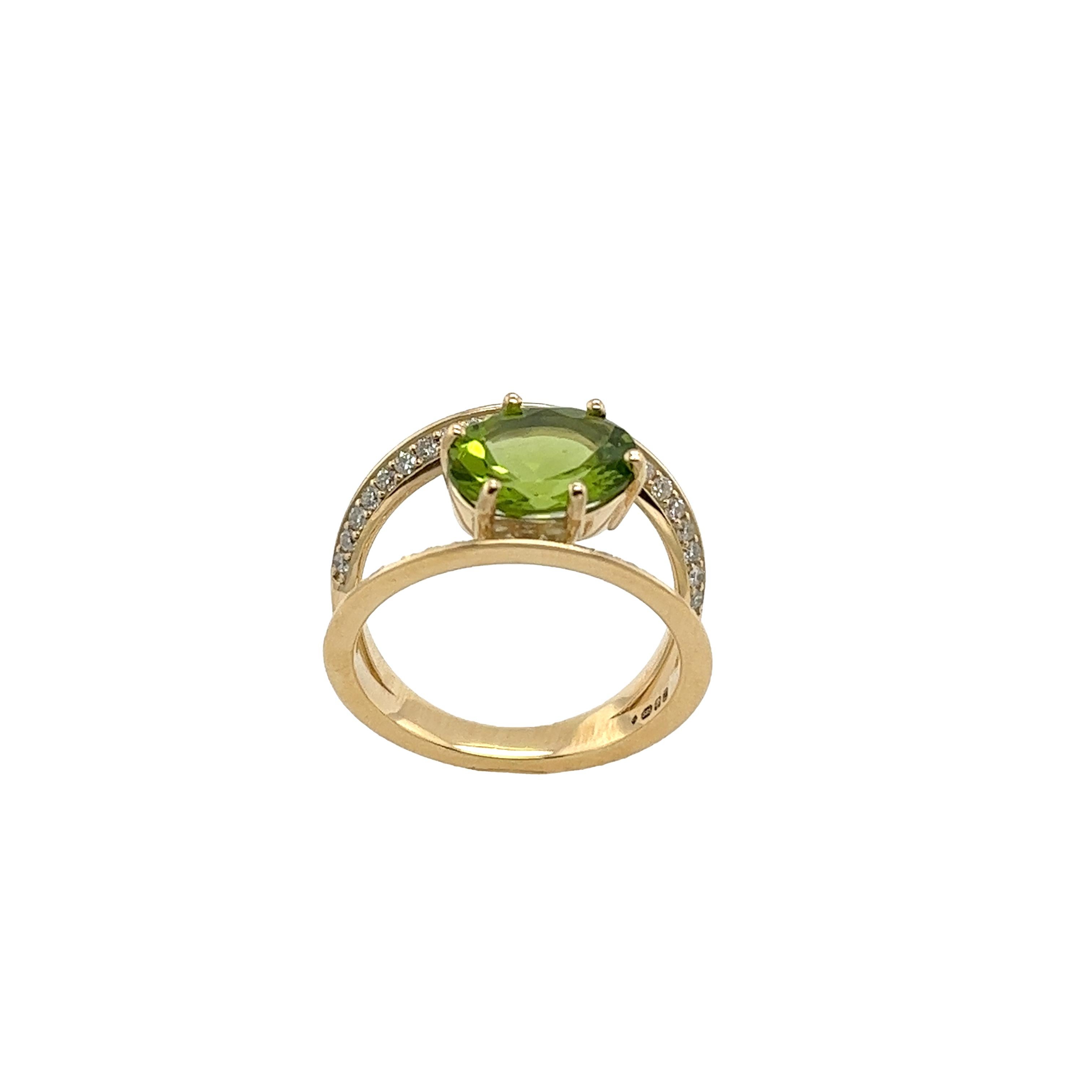 A 14ct Yellow Gold Diamond & Peridot Ring 
with 0.30ct small diamonds on the shoulders is a stunning and unique piece.
 The 0.30ct small diamonds set along the shoulders of the ring 
add a sparkling touch of sophistication. 
These diamonds enhance