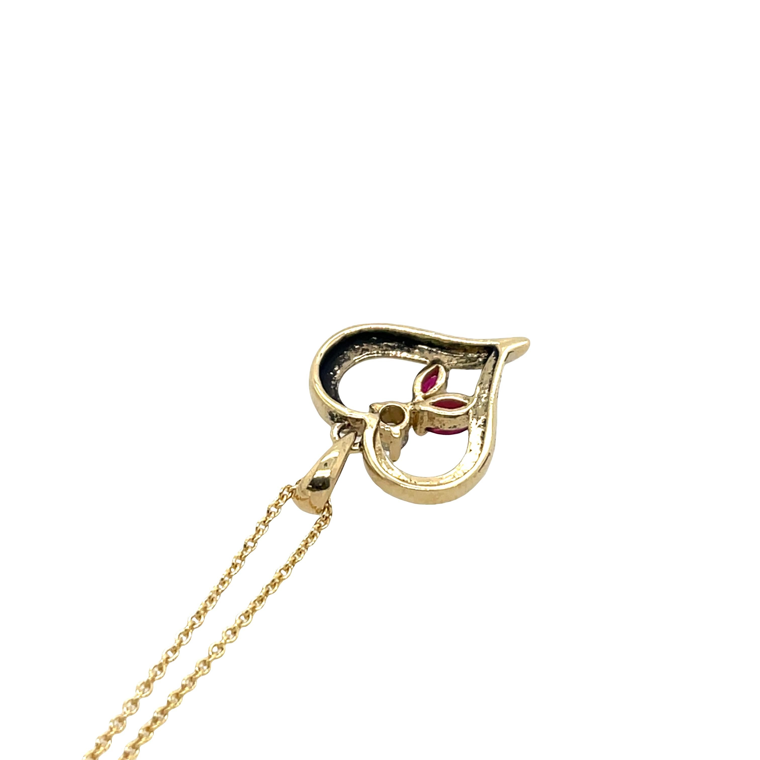 Pendentif en or jaune 14ct avec diamant et rubis sur une chaîne de 18
