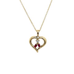 Pendentif en or jaune 14ct avec diamant et rubis sur une chaîne de 18".