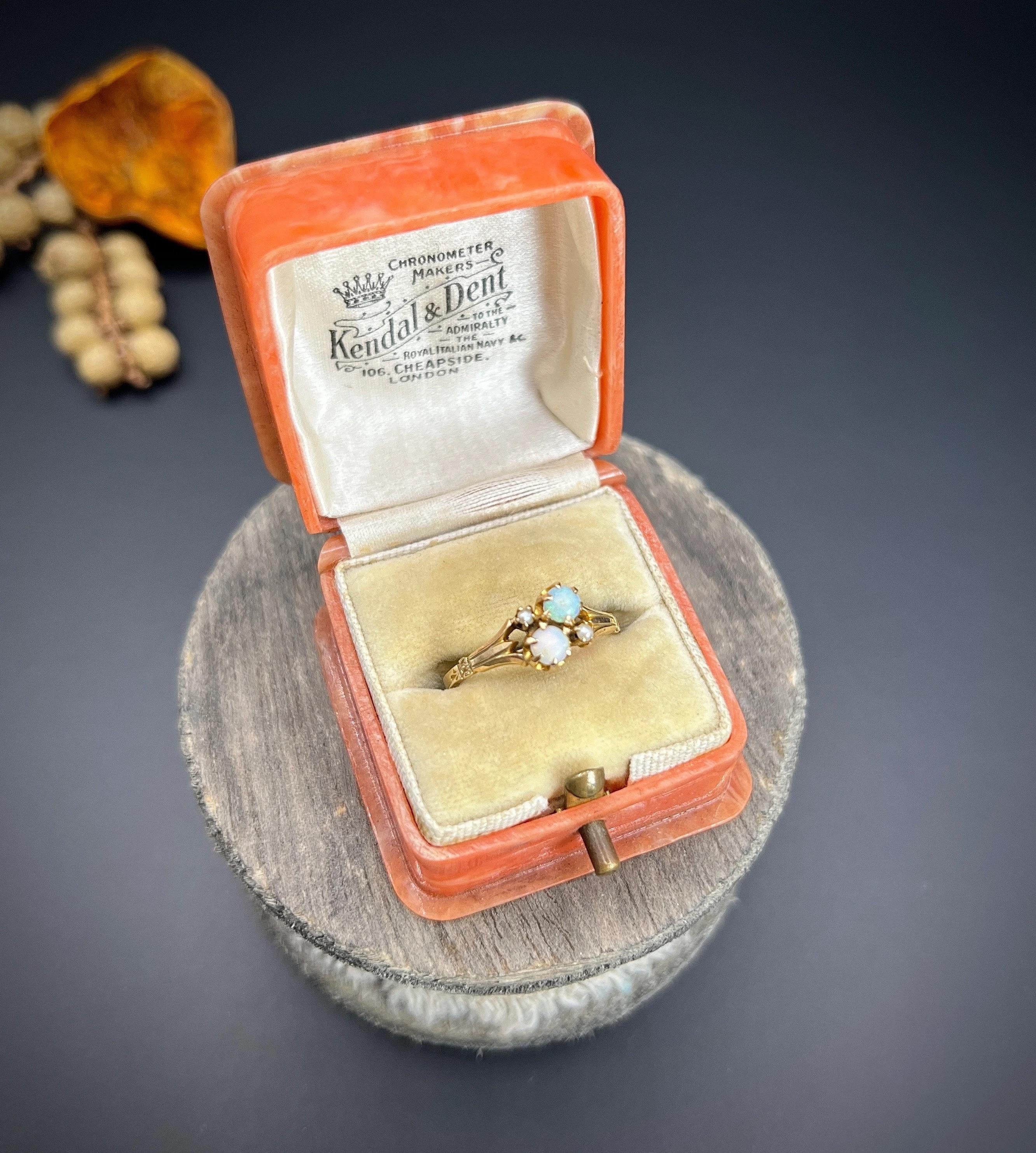 Antique Opal Ring 

14ct Gold Stamped

Circa 1910

Introducing a stunning 14ct yellow gold Edwardian era ring that exudes timeless elegance. This exquisite piece features two fiery opals positioned diagonally opposite each other, accentuated by a