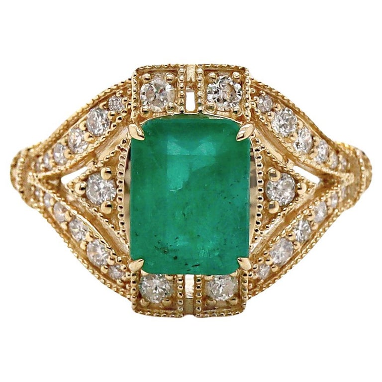 emerald green dress ring Oval Emerald Dress Ring with a Split Diamond Shank