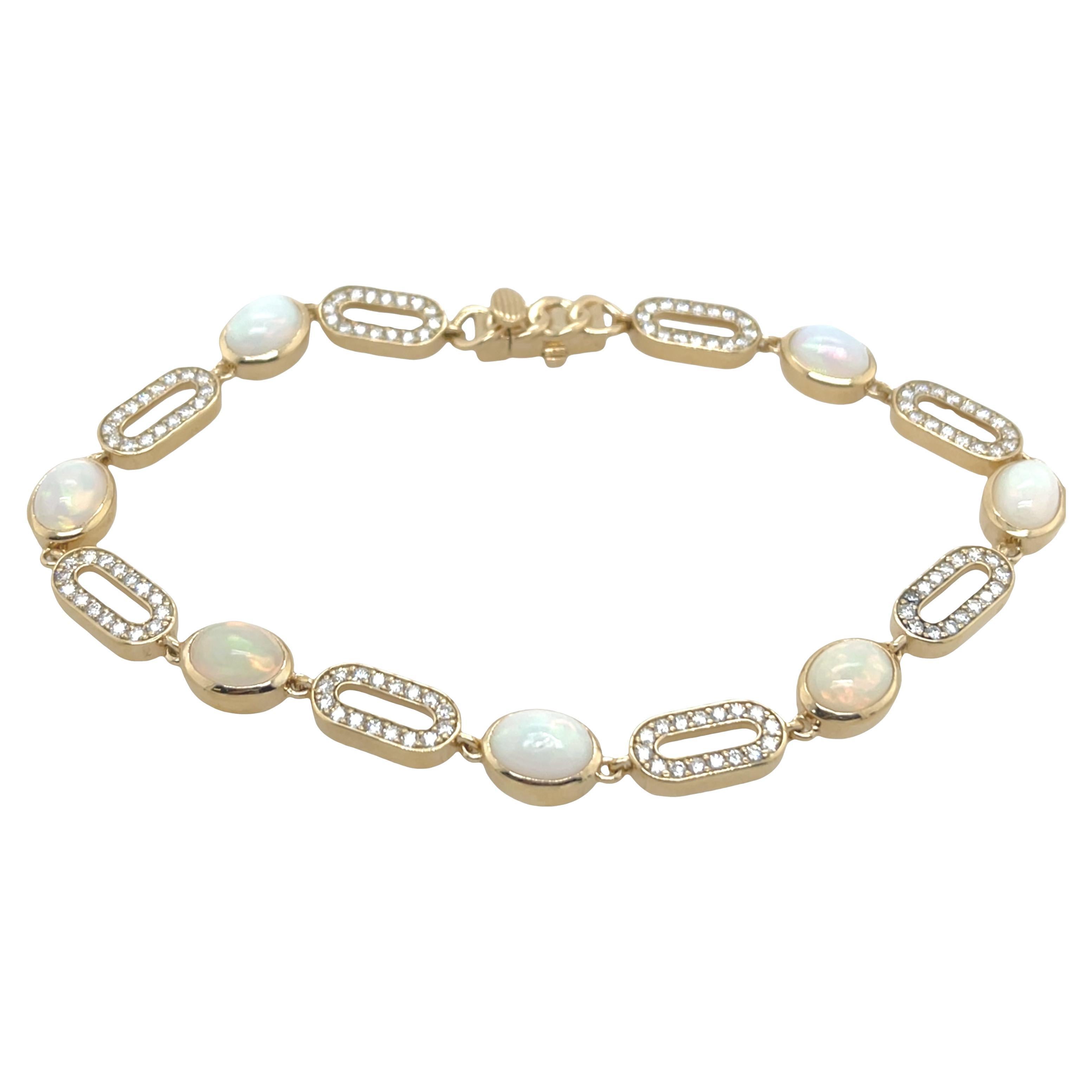 14ct Yellow Gold Opal 
Diamond Bracelet – 7 Oval Opals, 1.15ct Diamonds