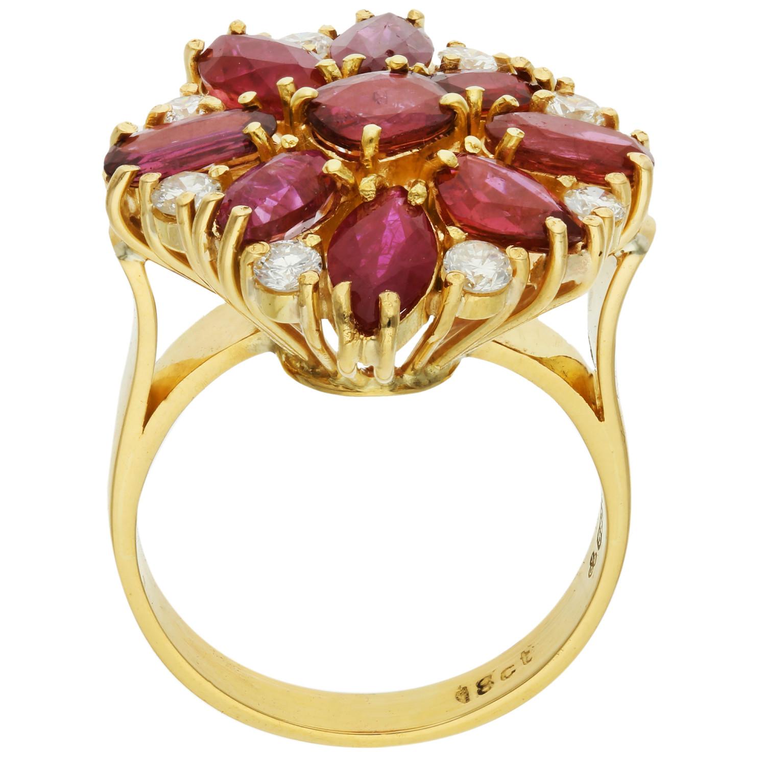 Ignite your style with our Pre-loved 14ct Yellow Gold Ruby & Diamond Ring, a flamboyant masterpiece perfect for both dress and cocktail occasions. This exquisite ring showcases a captivating floral design, featuring a vibrant collection of various