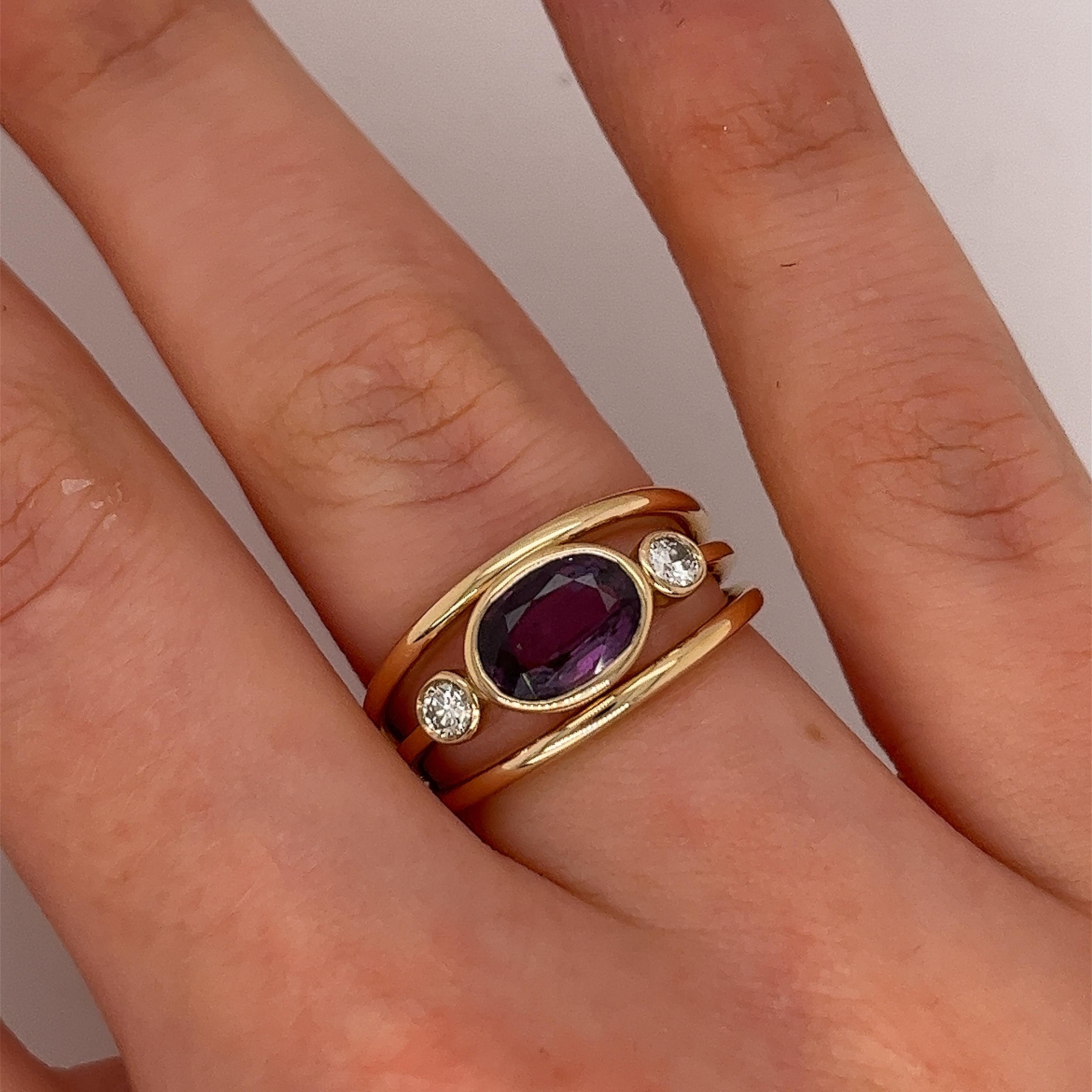 An elegant ruby and diamond ring, set with 2 round brilliant cut natural diamonds, 
and 1.16ct natural oval ruby, in a 14ct yellow-gold 3-row bezel setting.
Total Diamond Weight: 0.16ct
Diamond Colour: G/H
Diamond Clarity: SI1
Total Ruby Weight: