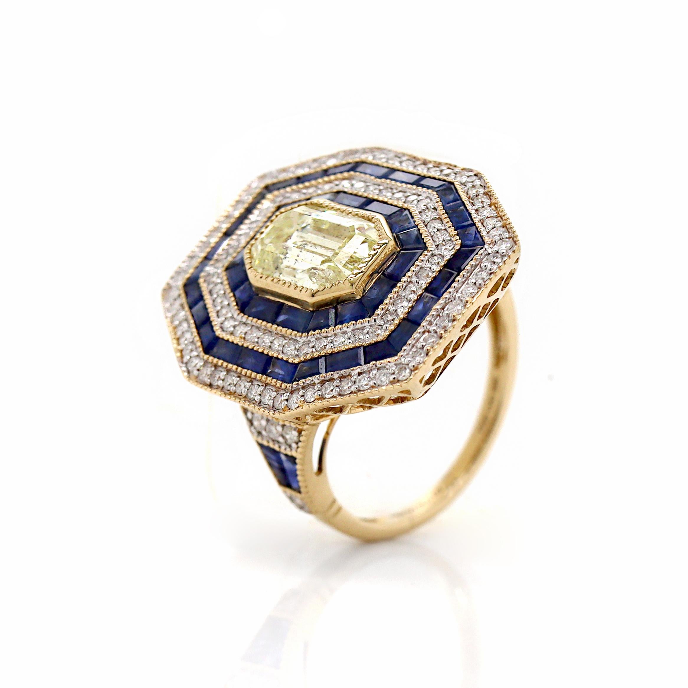14CT Yellow Gold Sapphire And Diamond Cocktail Ring

This Art Deco-inspired Sapphire and diamond cocktail ring is a breathtaking tribute to the bold glamour of the Jazz Age, combining luxurious color with geometric precision. At the heart of the