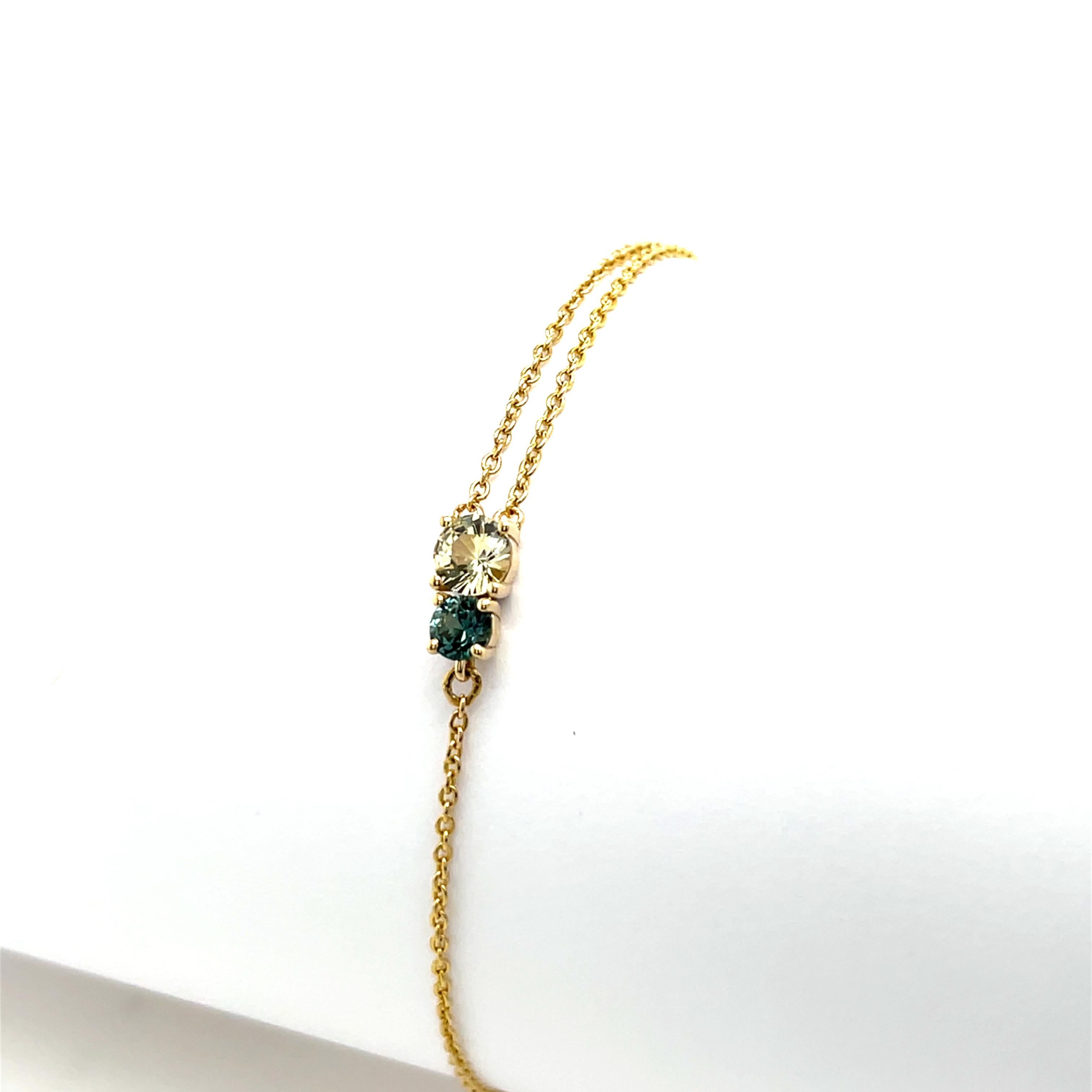 A beautifully crafted 14ct yellow gold bracelet, 
set with two stunning natural sapphires—one vibrant green sapphire and one elegant yellow sapphire. 
This unique piece combines classic gold elegance 
with a modern pop of colour.

Total Weight: