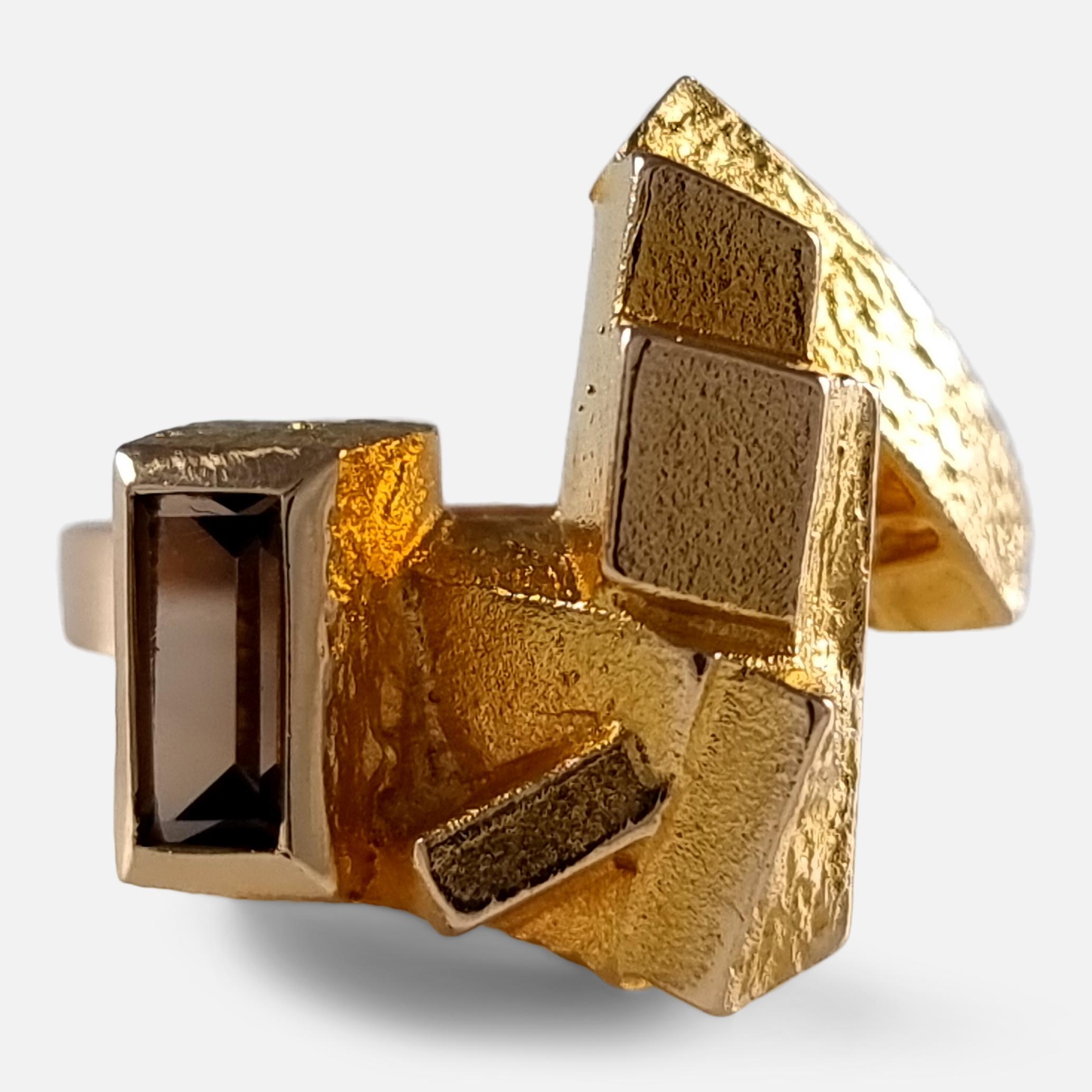 A Finnish 14ct yellow gold smokey quartz modernist ring designed by Björn Weckström for Lapponia.

The ring is hallmarked with the Lapponia makers mark, '585' to denote 14 carat gold, Finnish nation mark, date code 'S7' to denote 1971, 'FINLAND', &