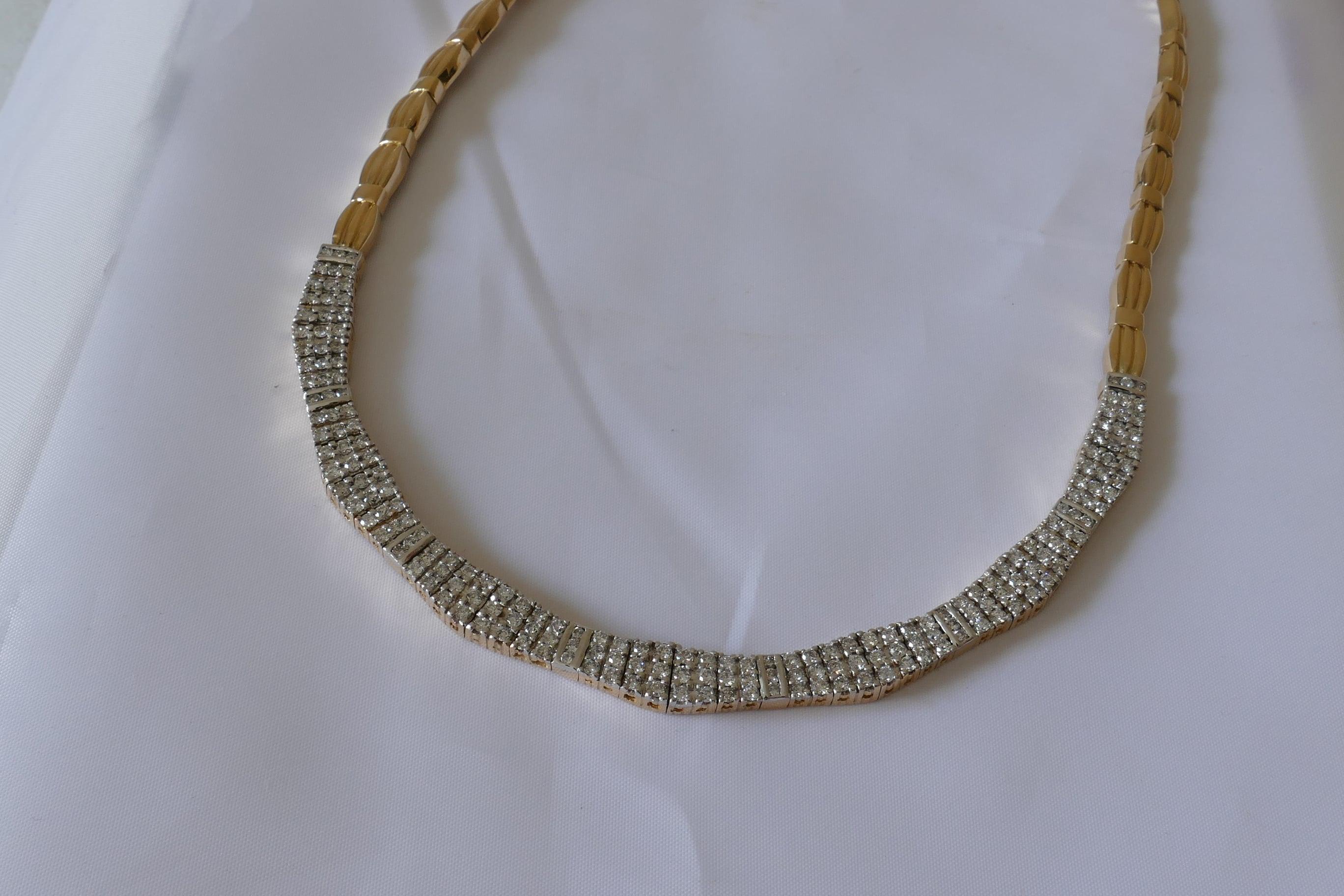 24 Round Brilliant Cut Diamonds high carat level colour of F-G, Clarity SI-1- to I-1, comprising nearly a half carat are Channel Set into this very attractive Necklace.
As well there are 168 Round Brilliant Cut  Diamonds of similar quality weighing