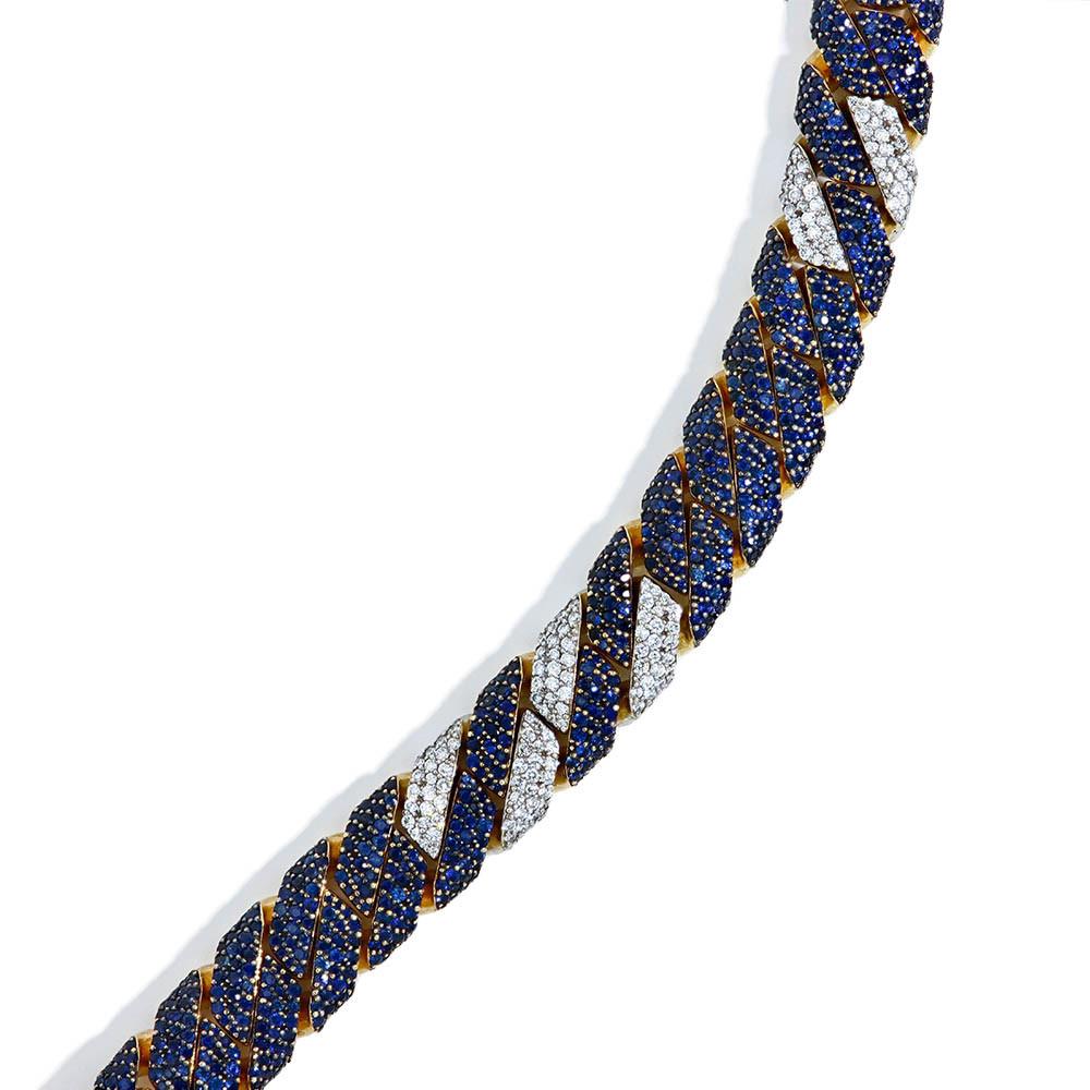A beautiful one-of-a-kind pavé cuban link bracelet made by J.R. Dunn Jewelers' award-winning in-house designer Robert Pelliccia. Crafted in 18k yellow gold, this unique cuban link bracelet features 14ctw in blue sapphires and 1.69ctw in diamonds,