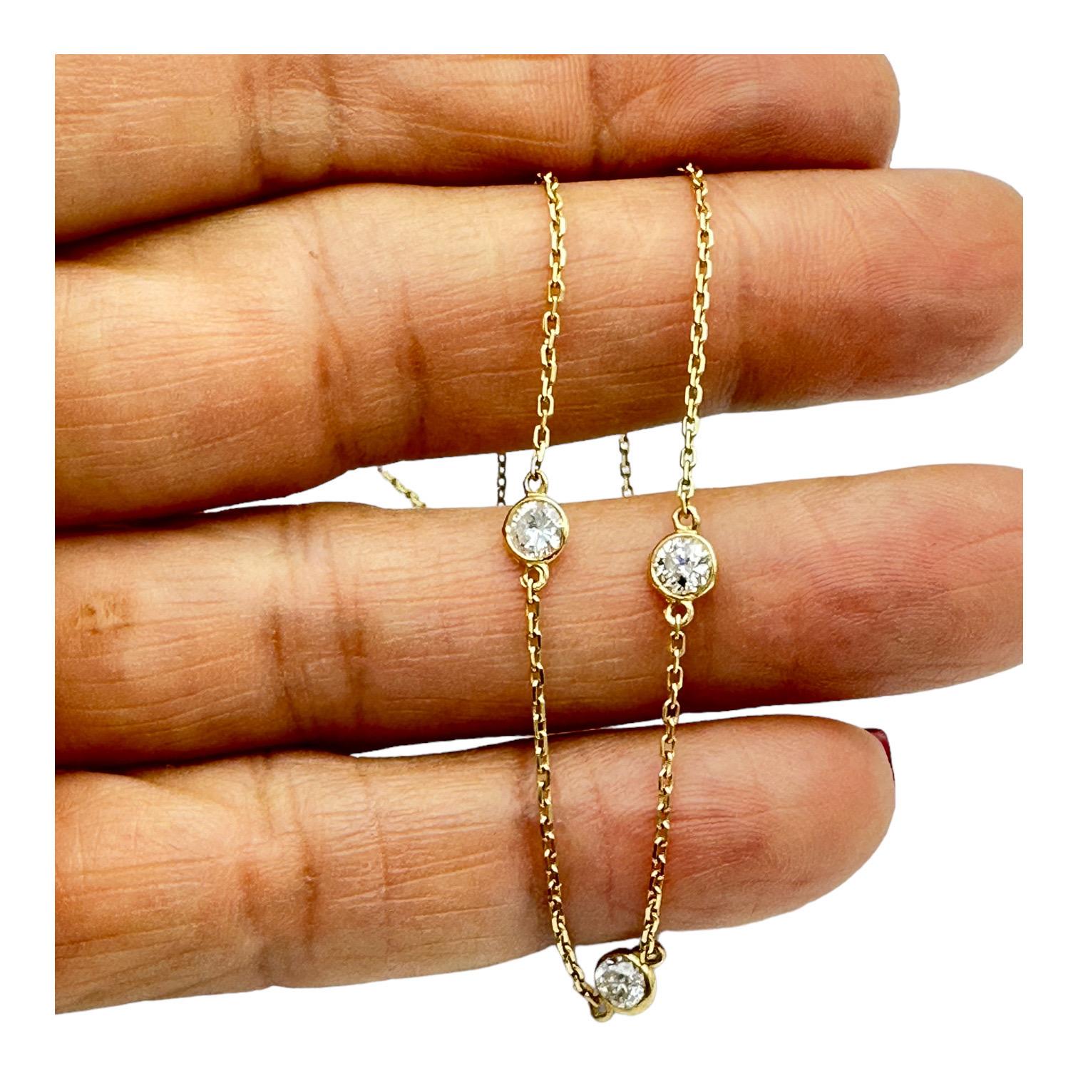 Stunning diamond cable-chain necklace consists of seven round brilliant cut diamonds. The total weight of the diamonds is 1.75 carats! Each stone is bezel set and secured while looped into this gorgeous chain necklace. 
Stunning diamond cable-chain