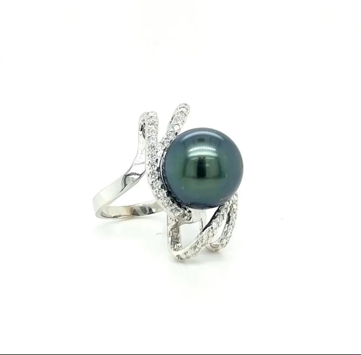 Certified and appraised 14 karat white gold Tahitian pearl and diamond cocktail ring.

The 13 mm dark gray Tahitian pearl is nestled in .63 carats of round, brilliant-cut F-G, VS2-SI1 diamonds. The ring is US size 6.5 and weighs 8.6 grams