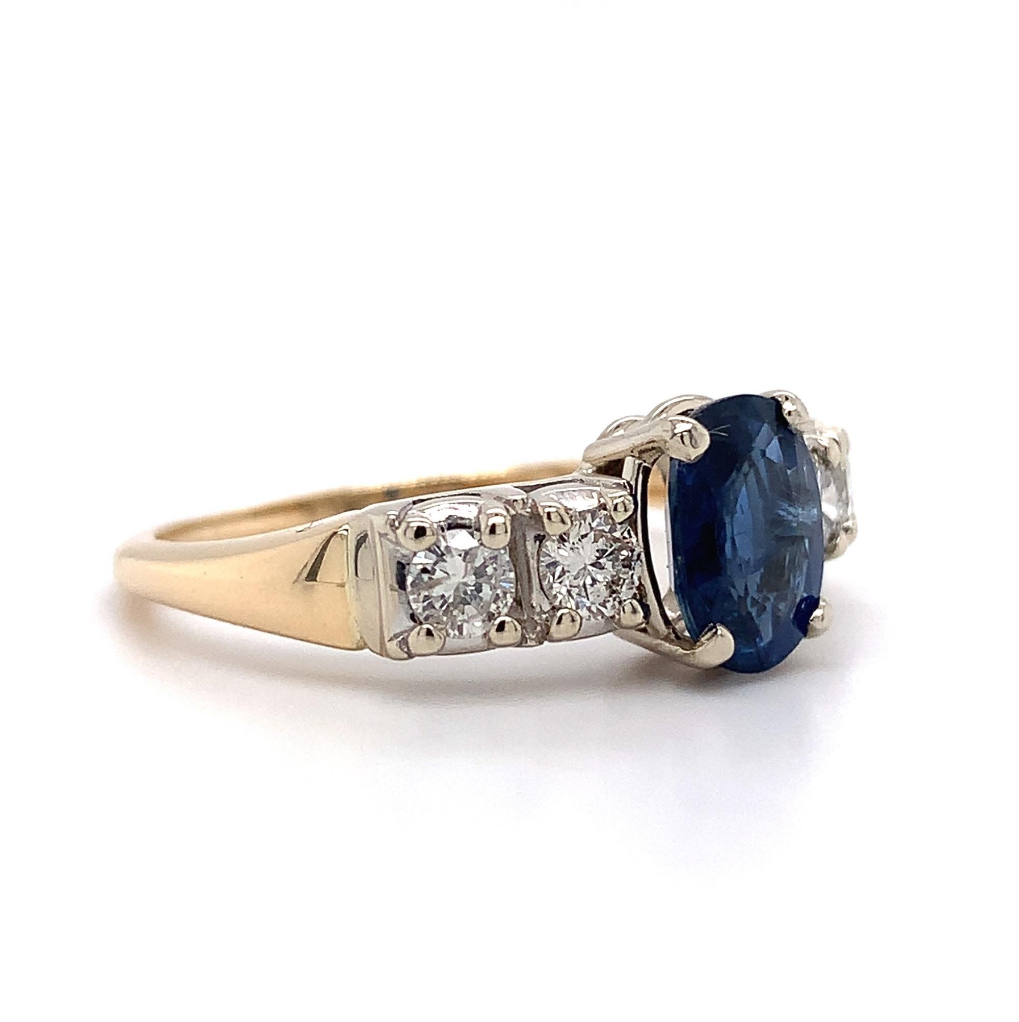 14K yellow gold sapphire and diamond ring featuring an oval blue sapphire weighing 1.52 carats. It measures about 7.8mm x 5.8mm.  The sapphire is large and has fine royal blue color. It does have a surface reaching natural inclusion. The sapphire is