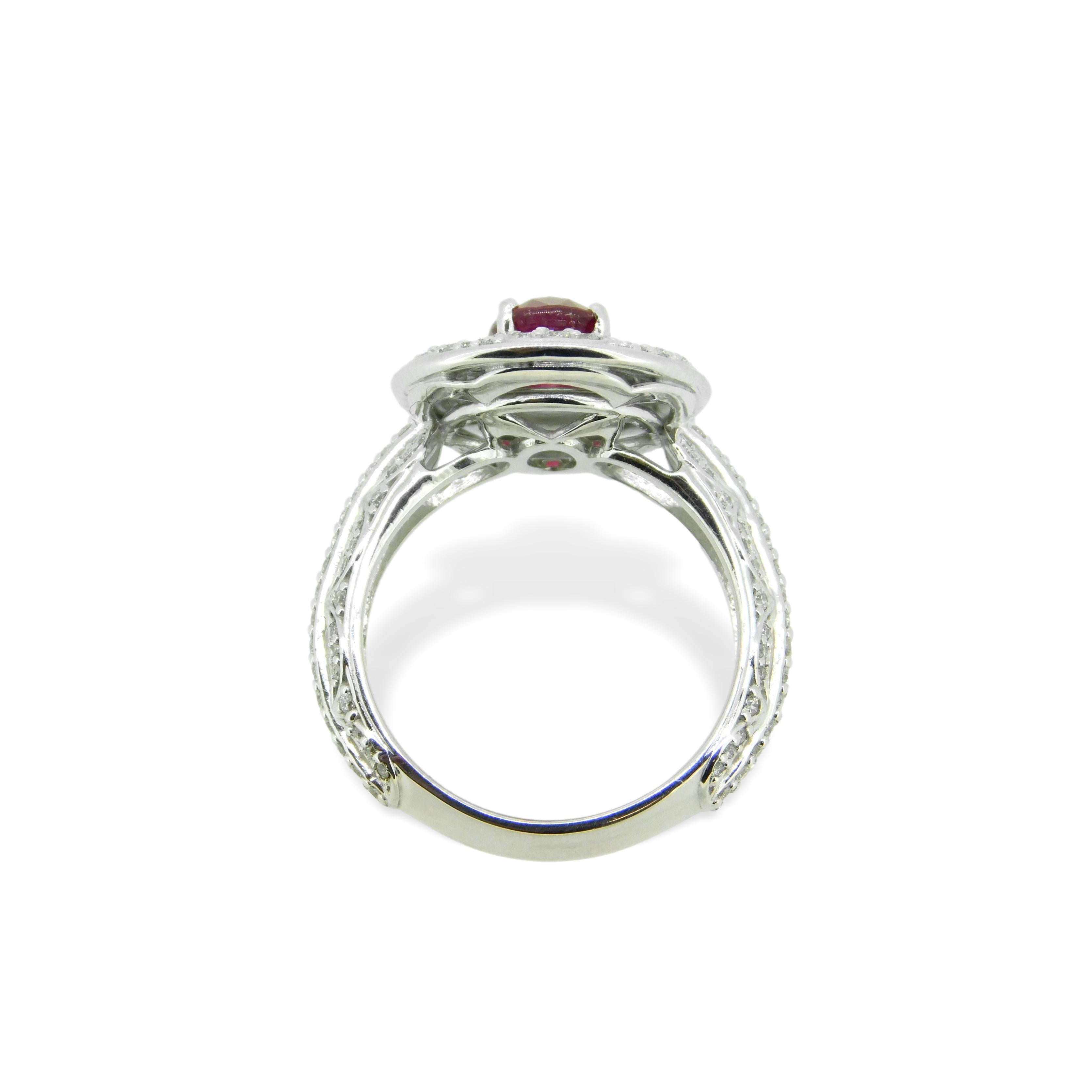 Top color GIA natural Burmese vivid red pigeon’s blood ruby weighing 1.57 carats set in 14K white gold with 1.5 carats of round diamonds. GIA Report included. The ruby measures 8.0mm x 5.8mm. The ring fits a size 7 finger, weighs 4.6dwt and is a