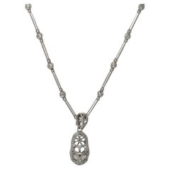 Collana con ciondolo a forma di scarpa in oro bianco 14K e 18K con diamanti 0,13ct