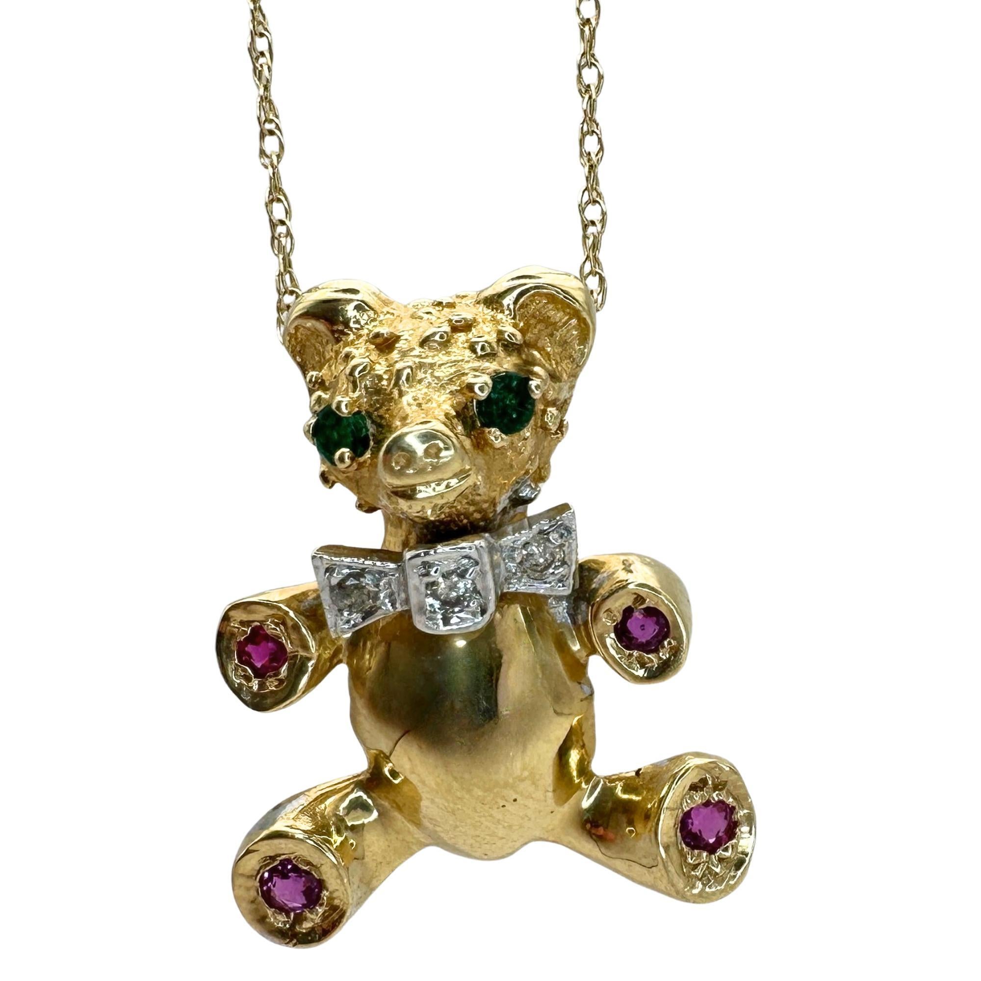 Add a touch of playful elegance with this stunning 14k 1980's Diamond, Emerald and Ruby Teddy Bear Pendant with Chain. The beautifully crafted pendant features 3.25 carats of sparkling diamonds, emeralds, and rubies, set in 14k yellow gold. With a