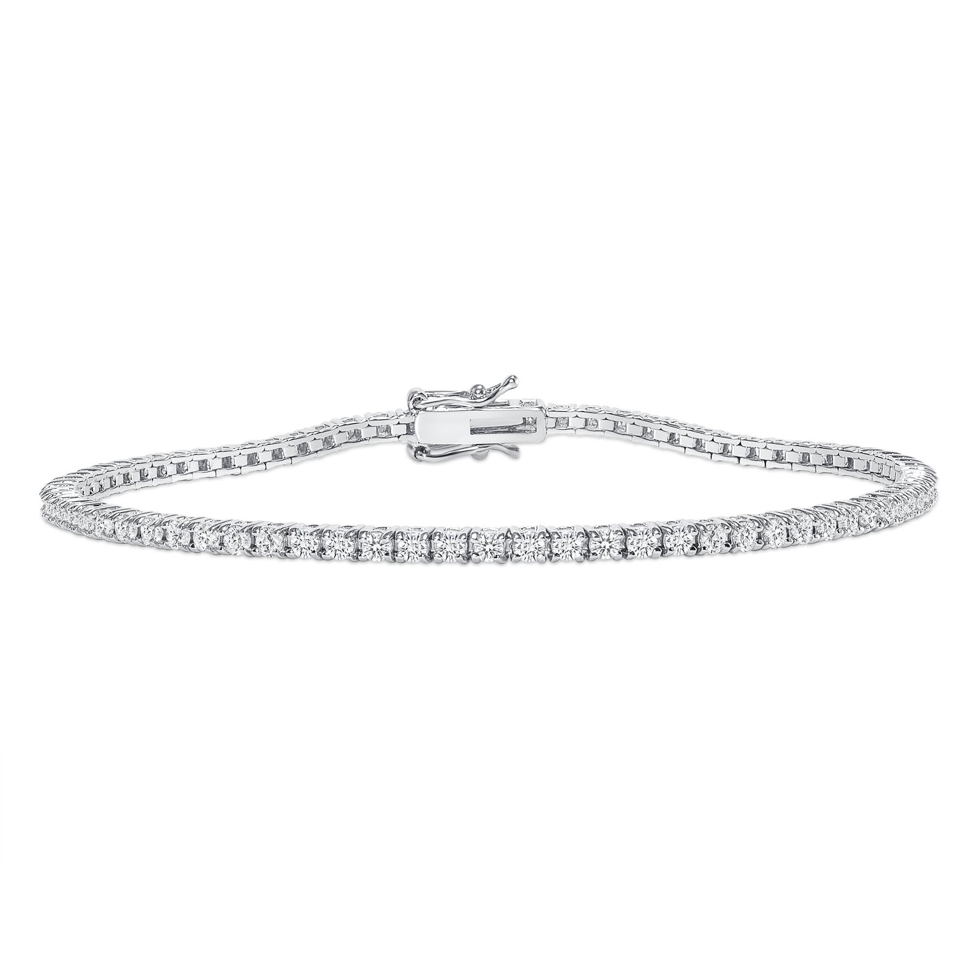 This diamond tennis bracelet features beautifully cut round diamonds set gorgeously in 14k gold.

Metal: 14k Gold
Diamond Cut: Round Natural Diamond 
Total Diamond Carats: 2ct
Diamond Clarity: VS
Diamond Color: F-G
Color: White Gold
Bracelet Length: