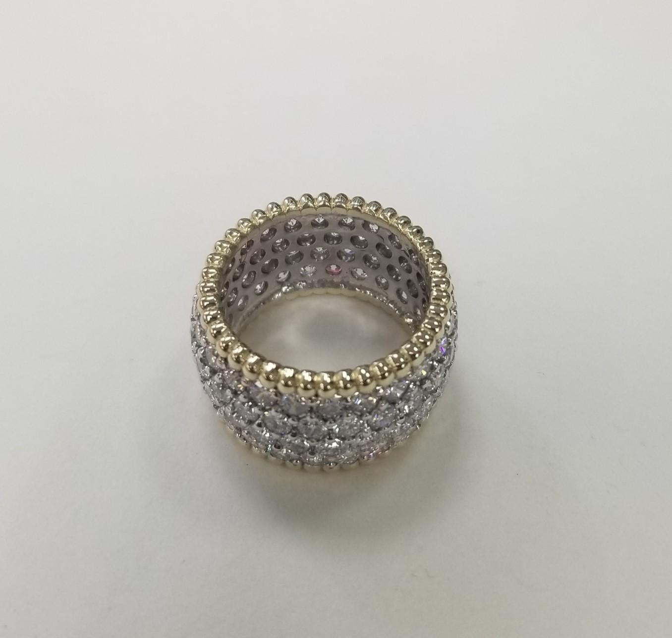 14k 2 tone gold 4 row set diamond eternity ring containing 96 round full cut diamonds of very fine quality weighing 7.03cts, ring size is a 7.5 but can be made to fit.
Specifications:
Metal: 14K White and Yellow Gold
Center Stone: 96 Diamonds 7.03