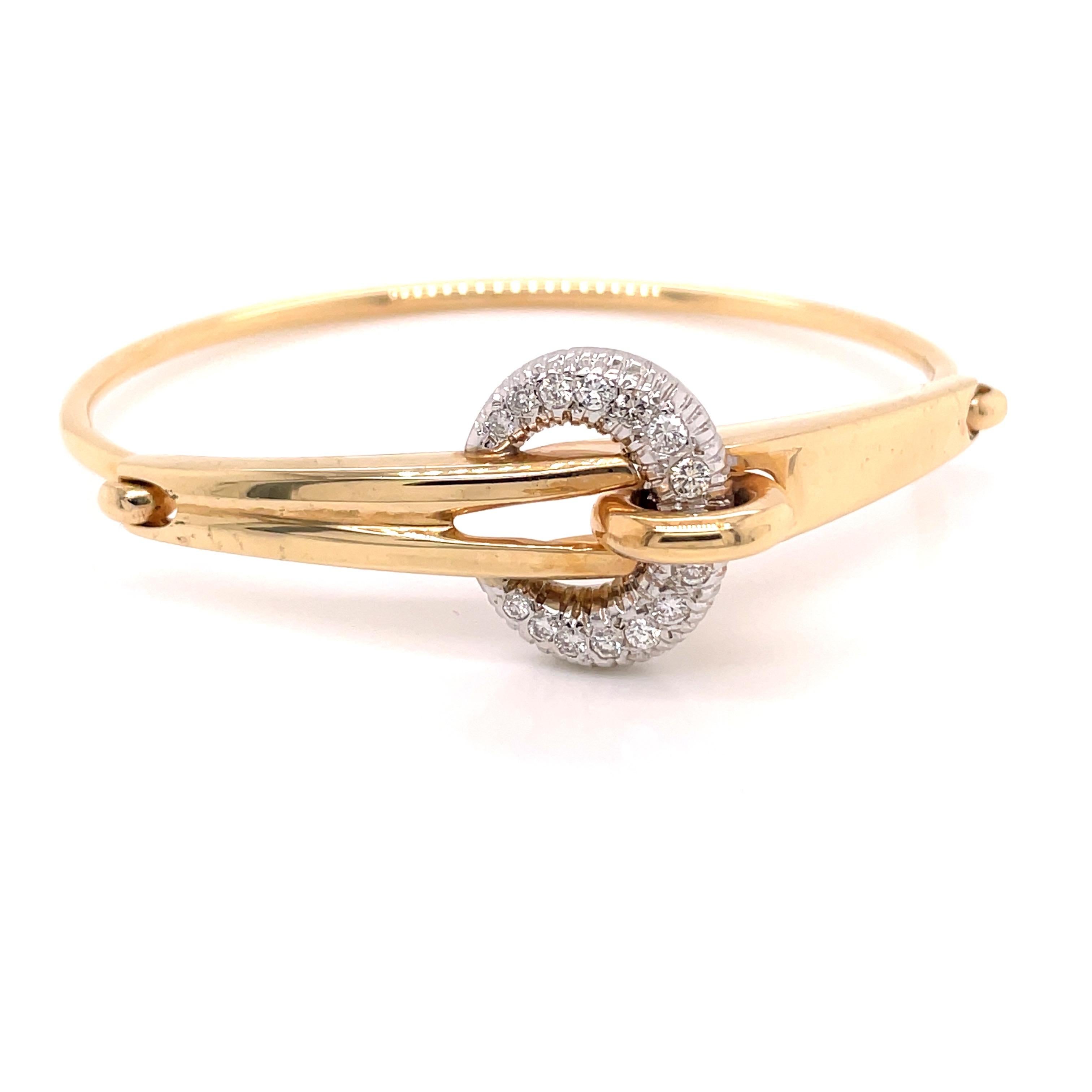14K 2-Tone Gold Diamond Buckle Bangle Bracelet .63ct - The bangle is set with 14 round brilliant diamonds weighing .63ct with G - H color and SI clarity. The width of the buckle is 19mm. The bangle tapers from 7mm on top to 2.3mm on the bottom. The