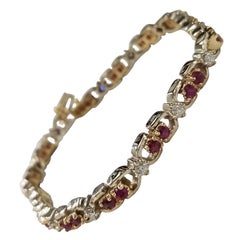 Bracelet en or 2 tons 14 carats avec rubis ovales et diamants, comprenant 25 rubis ovales de pierres précieuses