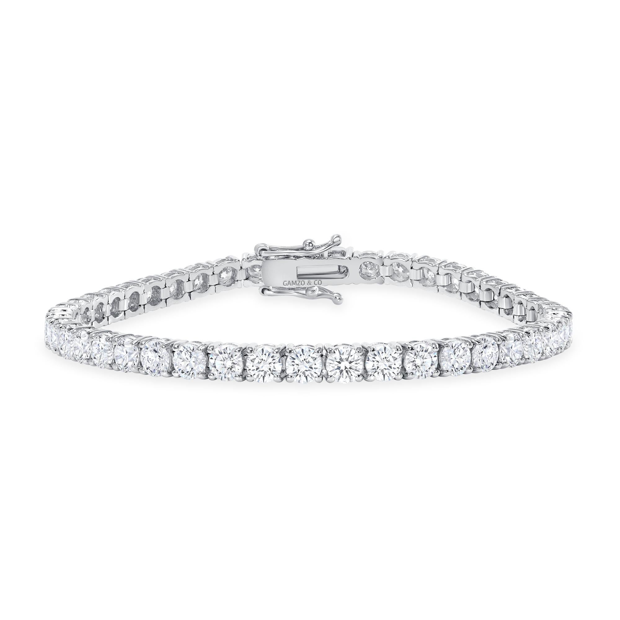 This diamond tennis bracelet features beautifully cut round diamonds set gorgeously in 14k gold.

Metal: 14k Gold
Diamond Cut: Round Natural Diamond 
Total Diamond Carats: 5ct
Diamond Clarity: VS
Diamond Color: F-G
Color: White Gold
Bracelet Length: