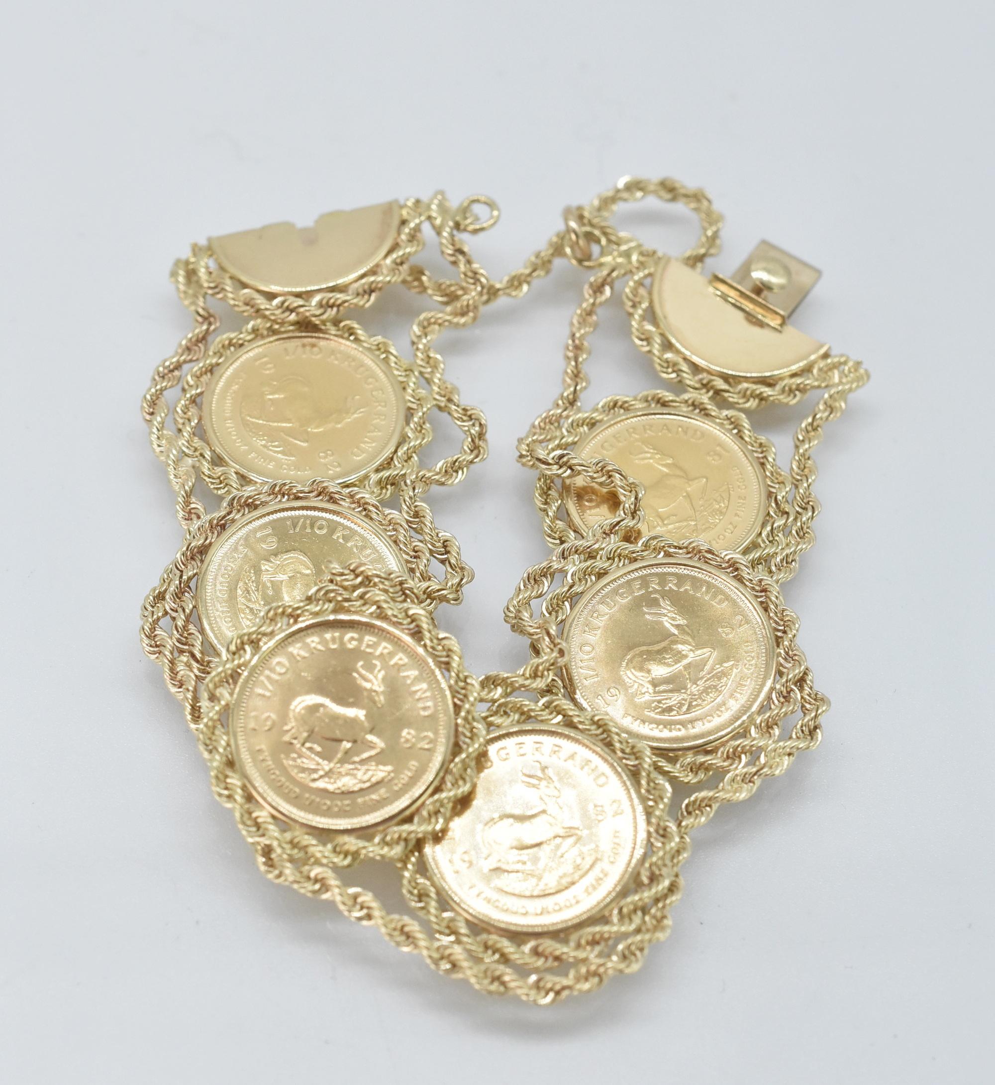 14K, 6 Coins, 1/10 oz Kugerrand Link Bracelet. 1/10 Kugerrand Coin bracelet, 6 coins in a twisted rope design link bracelet. Marked 14K. 6 3/4