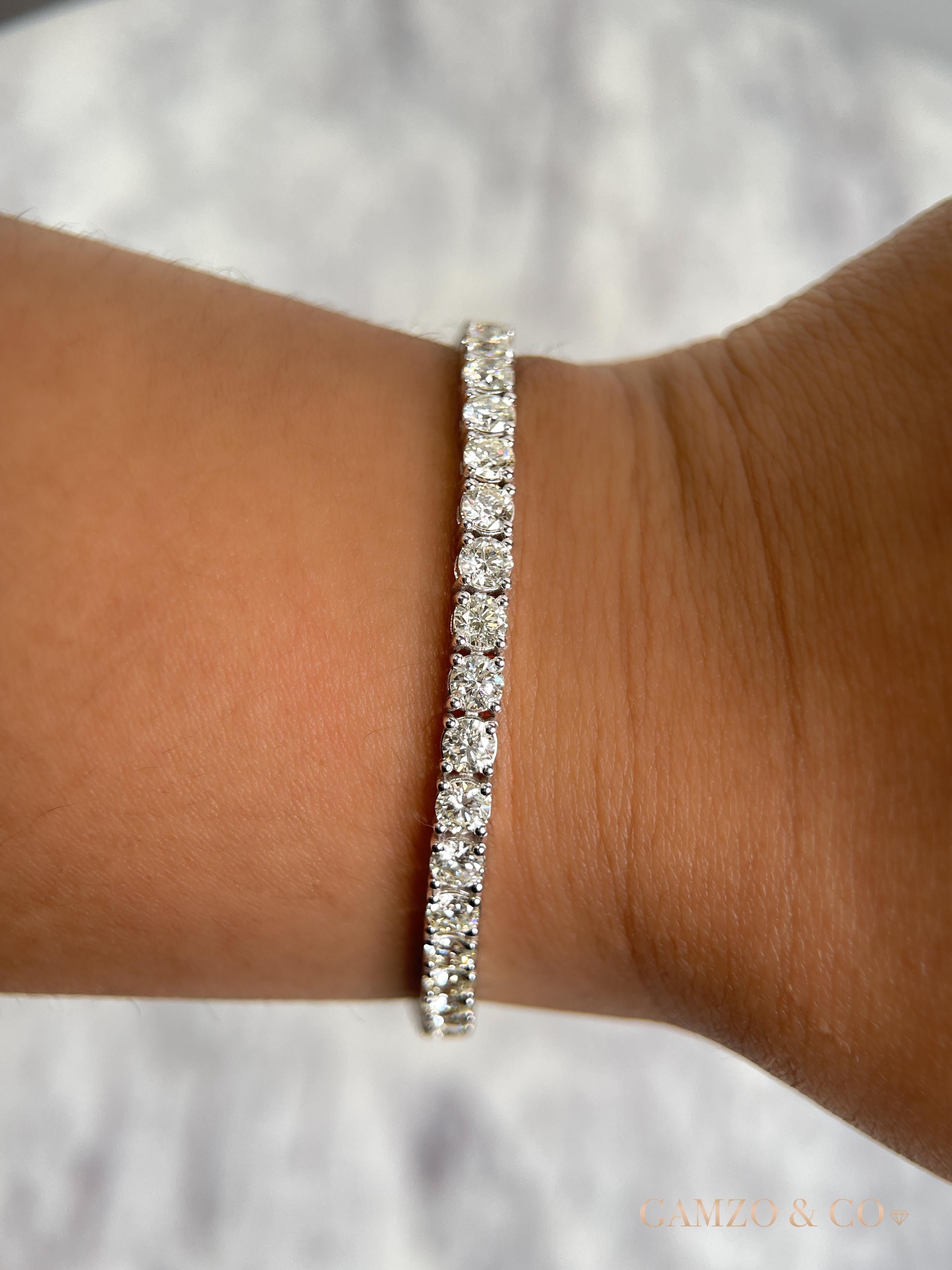 This diamond tennis bracelet features beautifully cut round diamonds set gorgeously in 14k gold.

Metal: 14k Gold
Diamond Cut: Round Natural Diamond 
Total Diamond Carats: 7ct
Diamond Clarity: VS
Diamond Color: F-G
Color: White Gold
Bracelet Length: