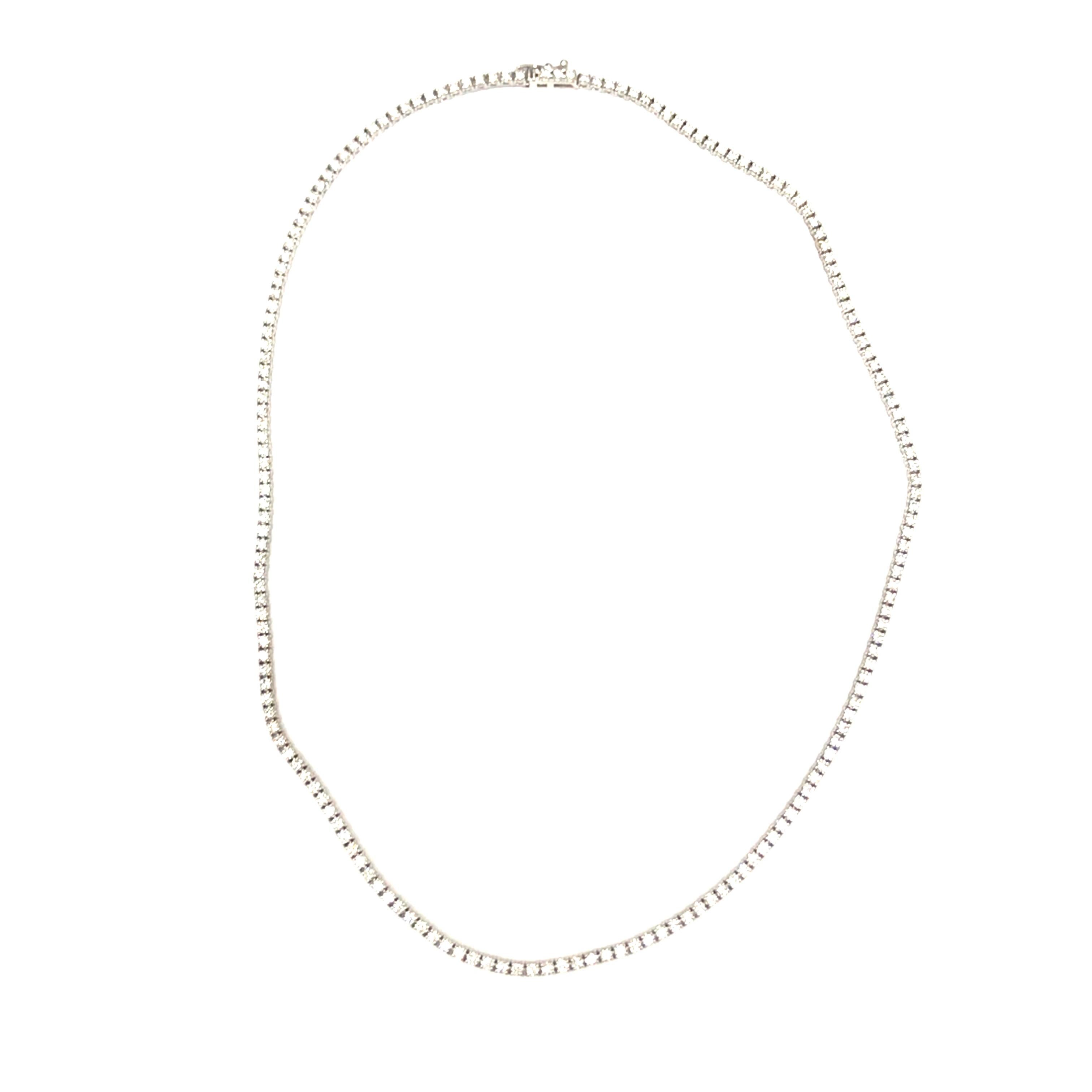 Diamond Tennis Necklace in 14K White Gold. Round Brilliant Cut Diamonds weighing 7.80 carat total weight, G-H in color and VS-Si in clarity are expertly set.  The Necklace measures 18 inch in length. 18.35 grams.