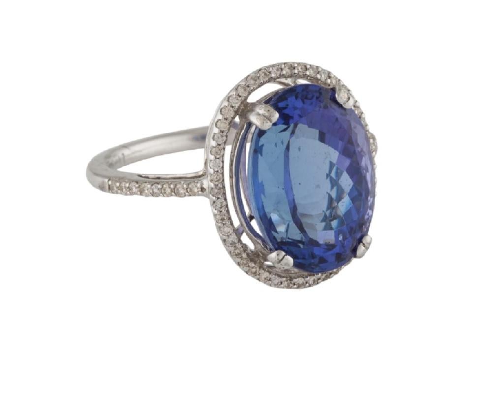 This is a gorgeous diamond ring tanzanite stamped in solid 14K white gold. The mesmerizing round brilliant diamonds have an excellent look and is set on top of a timeless 14K white gold band & tanzanite gemstone.

*****
Details:
►Metal: White