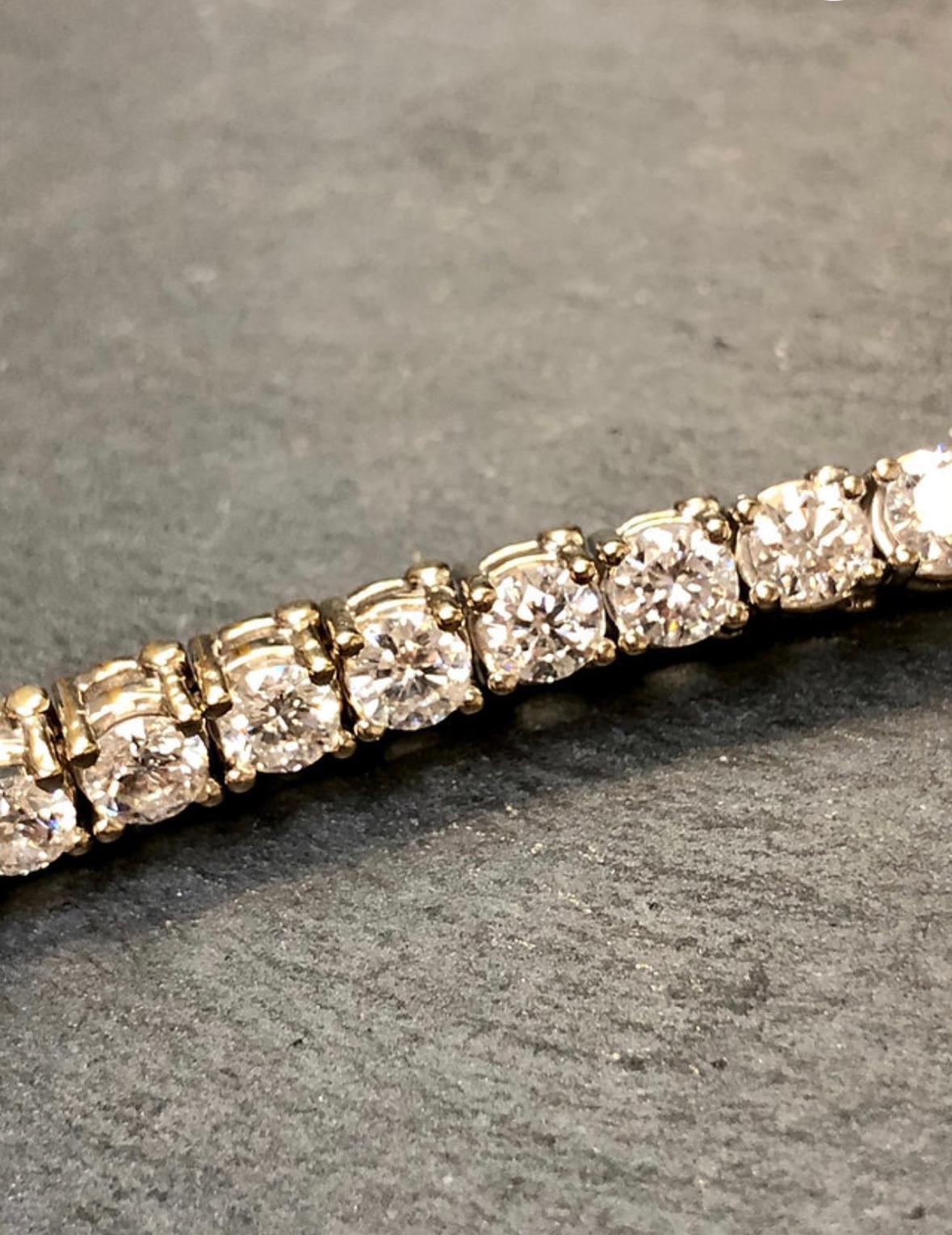 Classic tennis bracelet done in 14K white gold set with 36 round diamonds being G-H color and Si1-2 clarity with a total approximate weight of 9cttw.

Dimensions/Weight
6 3/4” long. Weighs 13.2dwt.

Condition
All stones are secure and clasp