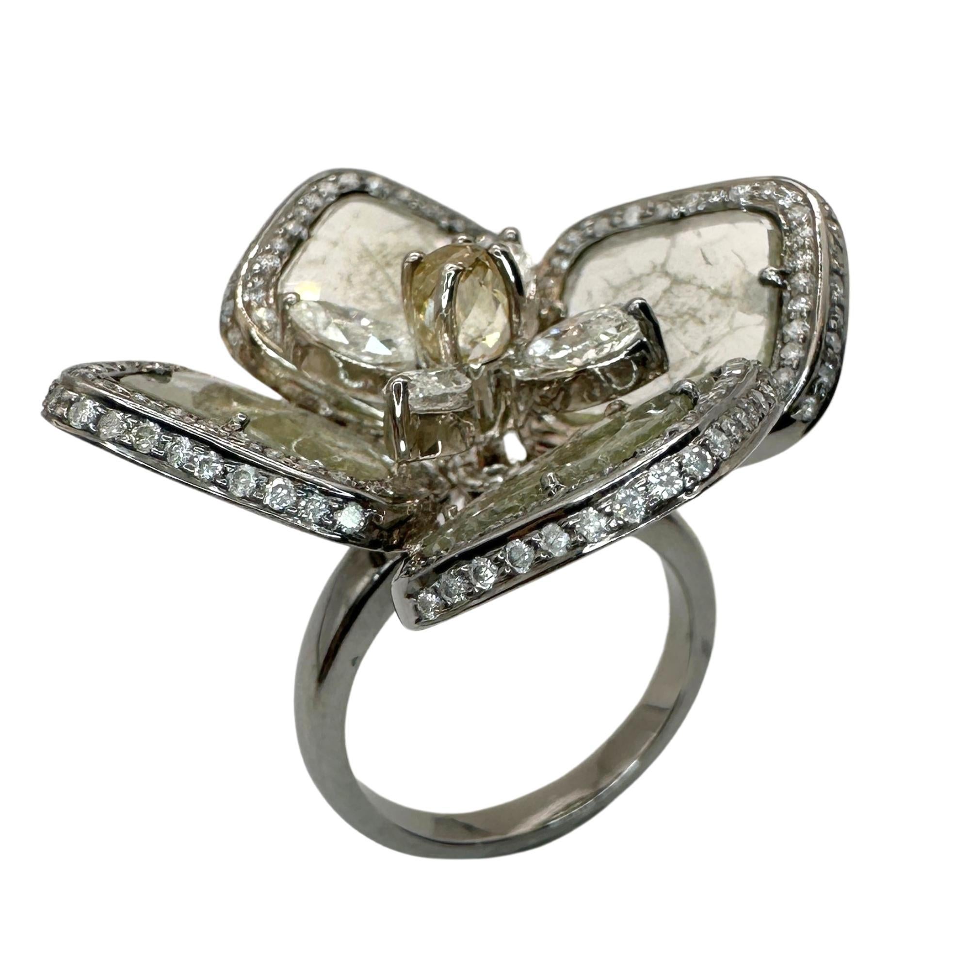 Indulge in luxury with our 14k All Natural Diamond Flower Cocktail Ring. Adorned with 8.25 carats of sparkling all natural diamonds, set in 14k white gold, this ring exudes elegance and sophistication. In good condition with minor surface wear, it's