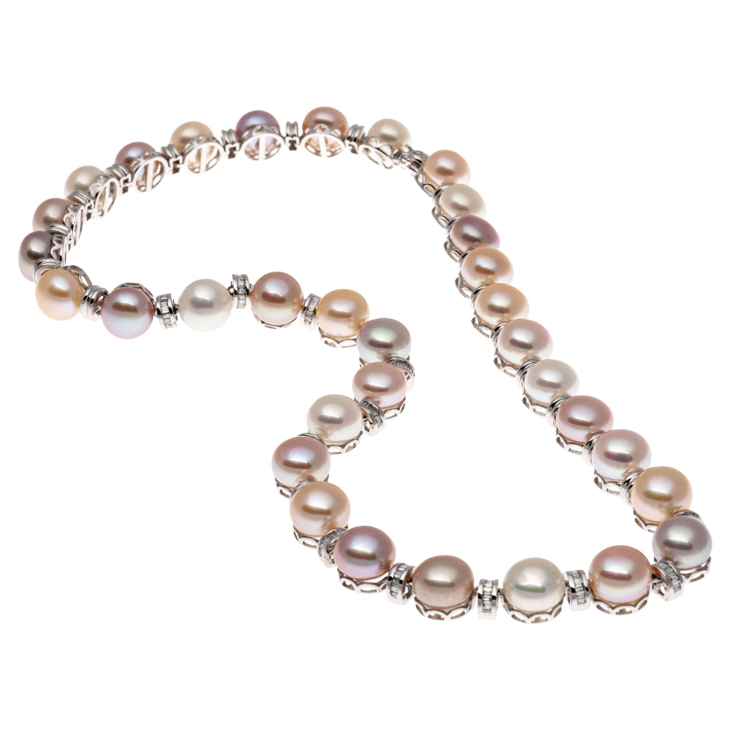 14k white gold necklace. This amazing necklace contains round, 9 mm to 9.25 mm cultured button pearls which are arrayed in a multitude of tones - pinkish white, purple, champagne, gold, rose, taupe - that alternate with half rondelle shaped links,