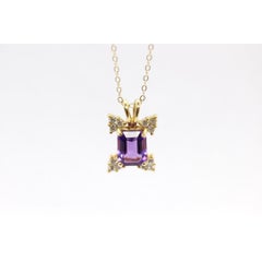 14k Amethyst emerald cut with Diamonds pendant. Diamond cluster star and 16in