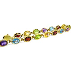 14 Karat Amethyst, Peridot, Garnet, Blue and Yellow Topaz Ladies Bracelet