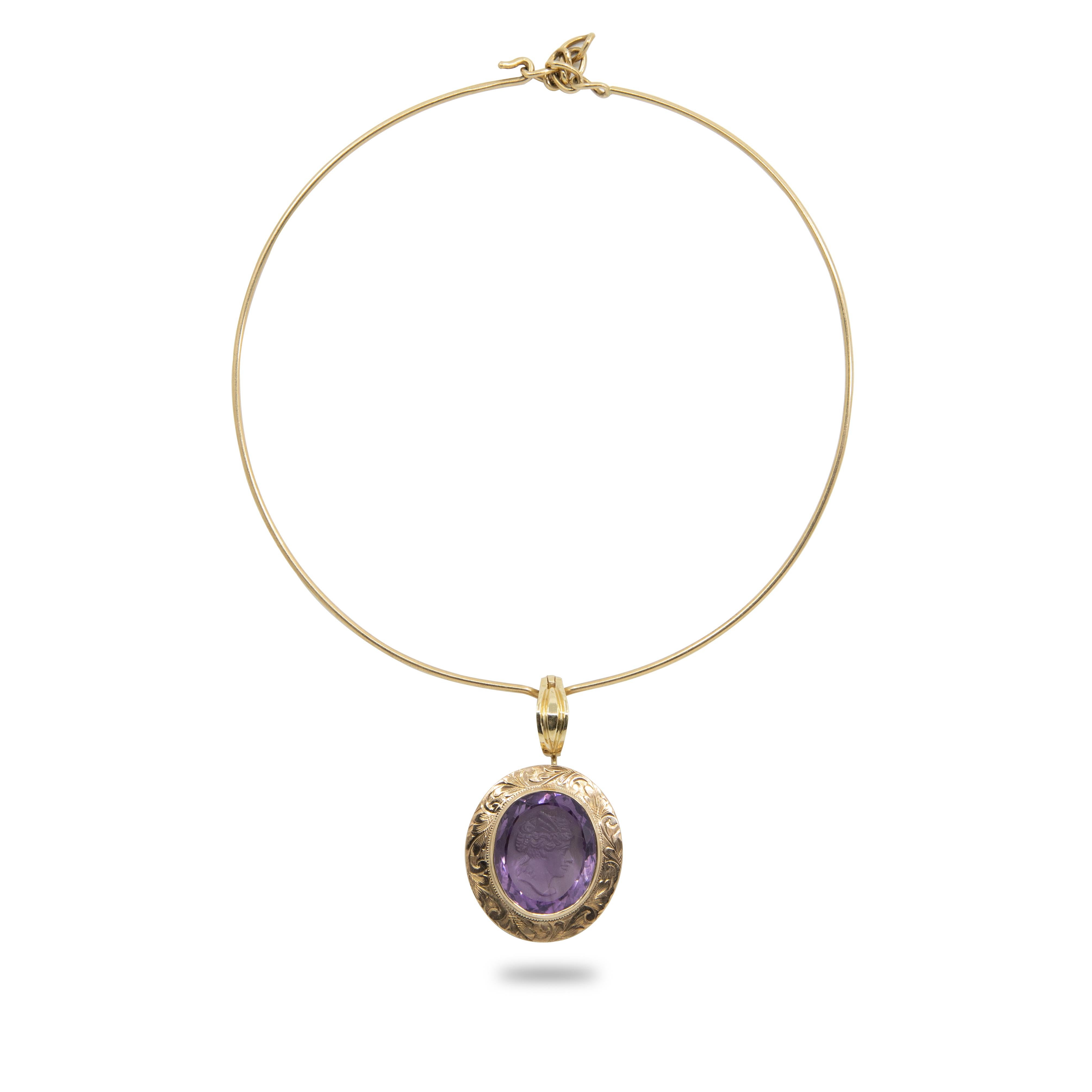 Offered is a 14K and 10K gold amethyst cameo necklace, 18.7dwt. This exquisite intaglio is masterfully engraved onto Amethyst and is set in a 14K Gold Pendant that hangs on a 10K Gold Necklace. 