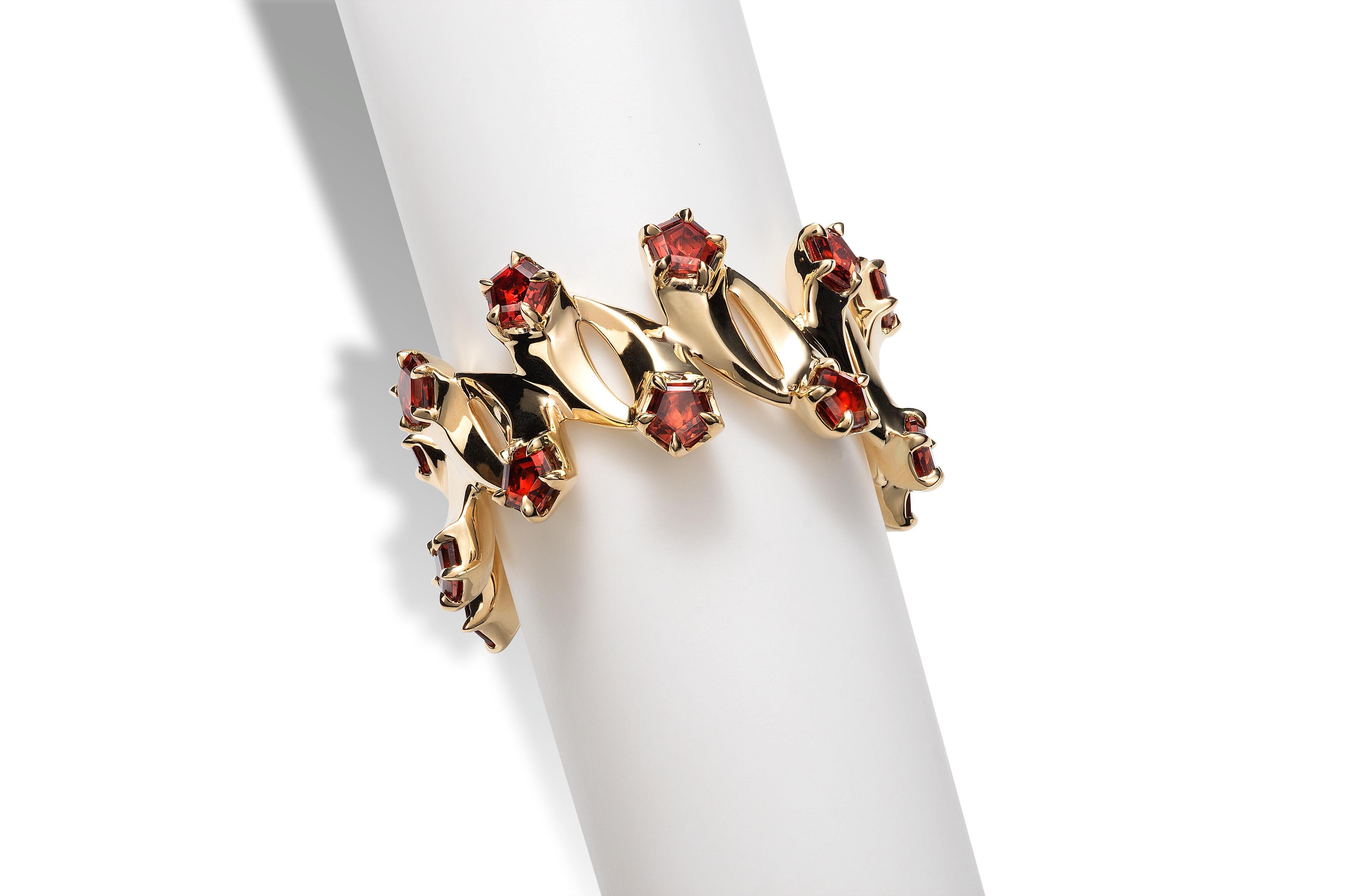 The 14k and Madeira Garnet ring is an eternity style ring with 18 connecting comets that wrap around your finger. The head of each comet is a fancy cut 3.5mm garnet.  (Wow - with 18 shooting stars on your finger, that gives you 18 wishes!!! ) The