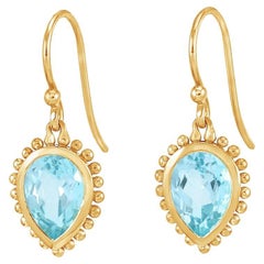 Boucles d'oreilles Anémone 14k avec Topaze Bleue 