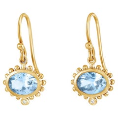 Boucles d'oreilles pendantes anémone ovale 14 carats avec topaze bleue et diamants