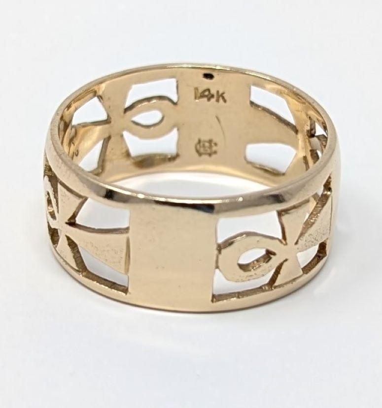 Intriguing ankh band in fine 14k solid yellow gold, features an open metalwork design. Signed on the interior with 14K and an unknown makers mark. It is also etched on the interior of the band with W.A.C. I LOVE U S.L.C. Best measures for a US size