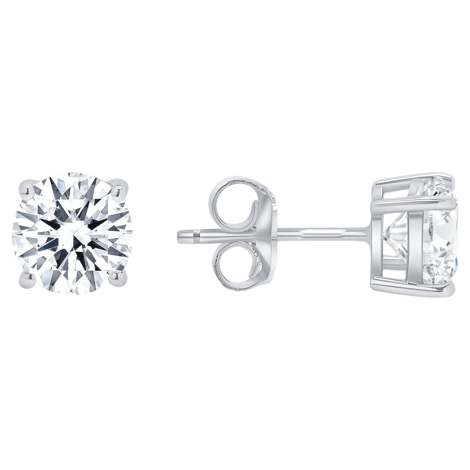 These diamond stud earrings beautiful matched, feature a pair of round diamonds set in a classic 14k gold setting

Earring Information
Setting : 4 Prong Push Back
Metal : 14k Gold
Diamond Carat Weight : 1 Carat
Diamond Cut : Round Natural Conflict