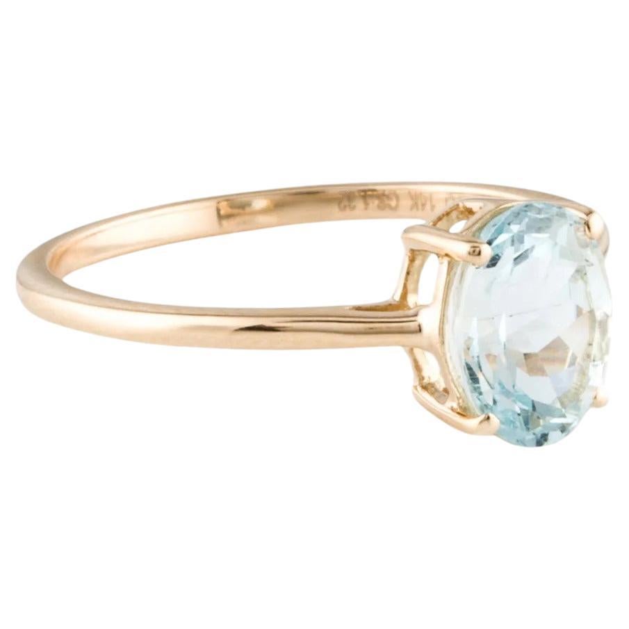 Elevate your style with this exquisite 14K Yellow Gold Cocktail Ring, showcasing a dazzling 1.32 Carat Oval Cut Aquamarine. The captivating blue gemstone exudes elegance and sophistication, making it a perfect statement piece for any occasion.