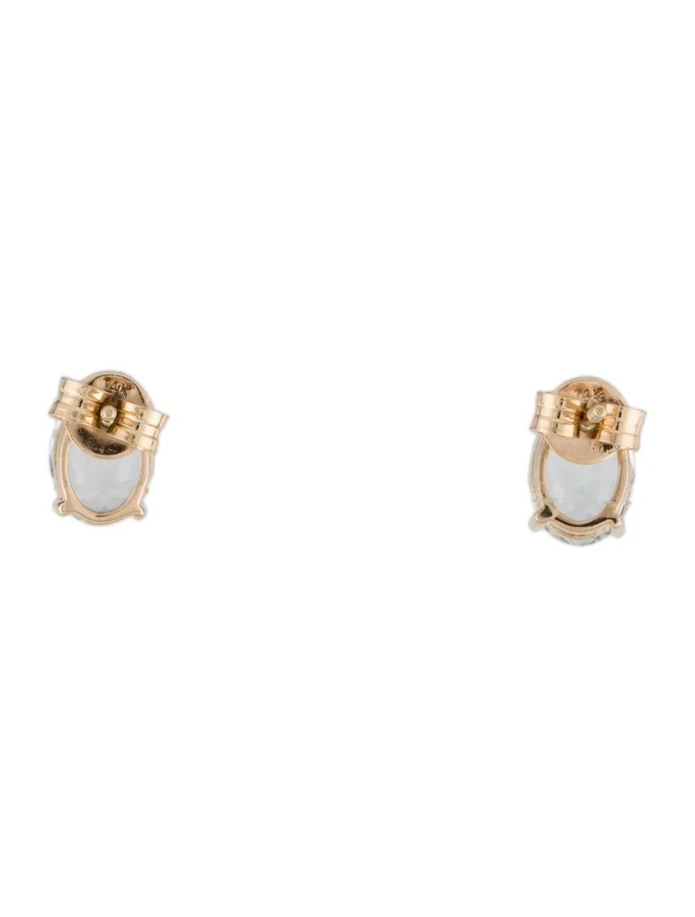 Oval Cut 14K Aquamarine Stud Earrings - Elegant Blue Gemstones, Timeless Design, Luxury For Sale