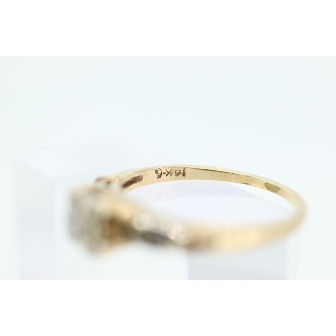 Vintage from the 1920s
Size: 5 US
Materials: Stone
Gemstone: Diamond
Gem Color: Colorless
Band Color: Silver

Style: Art Deco

Beautiful Art Deco ring. 14k white and yellow gold. Amazing piece when worn. diamonds on shoulders.

Details:
1.6grams