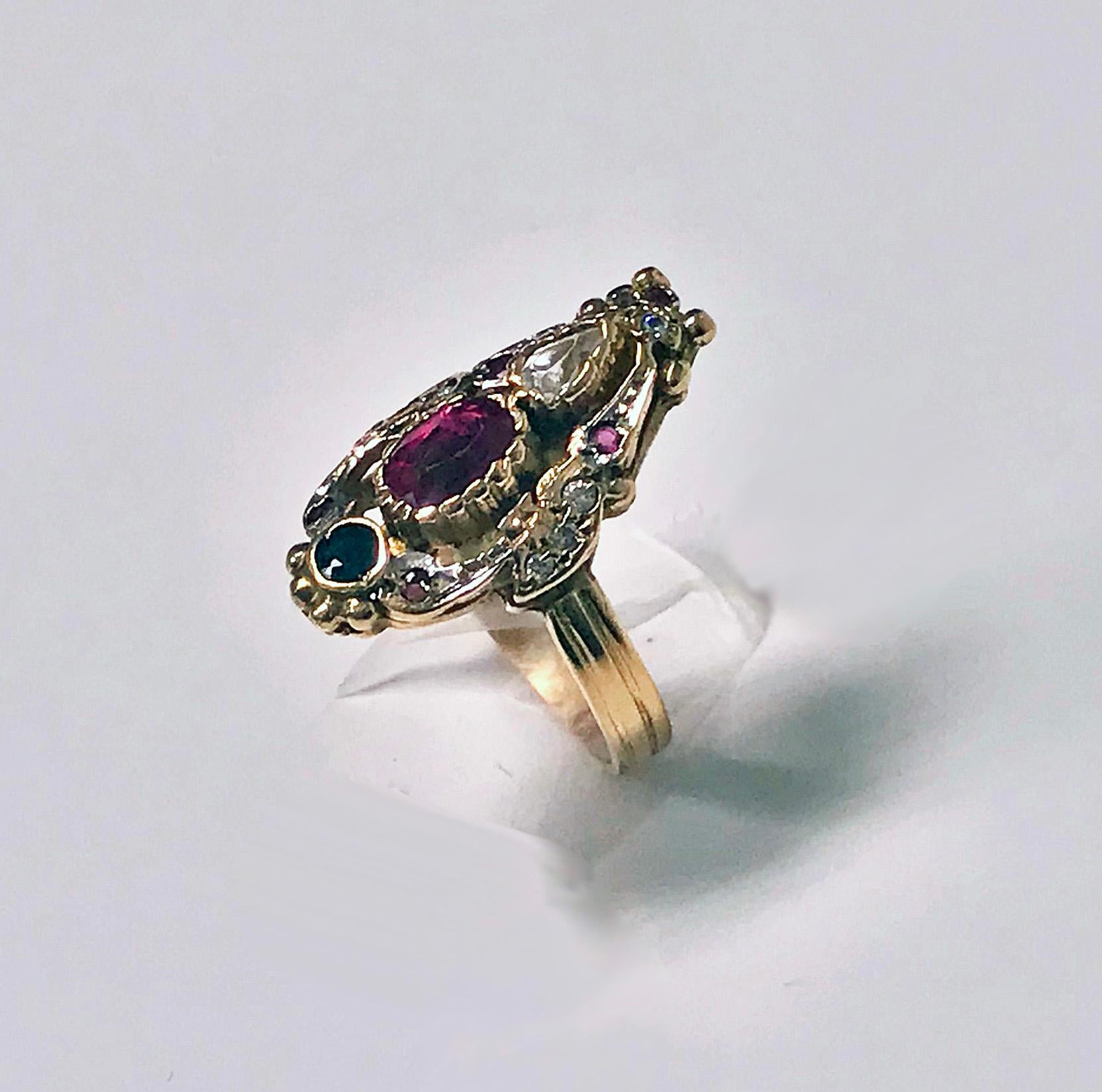 14K Art Nouveau style paste Ring, C.1930. The Ring of open stylised form set with red, blue and white stones, triple reed shank, stamped 585 on interior. Acid tested for 14K. Total Item Weight: 7.54 grams. Ring Size: 8.75.