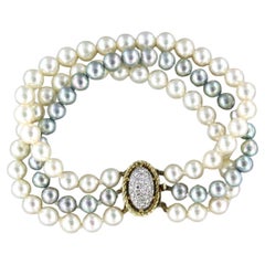 Vintage 14k bicolour gold lock with diamonds in total 0.50ct, 3-row pearl bead bracelot 