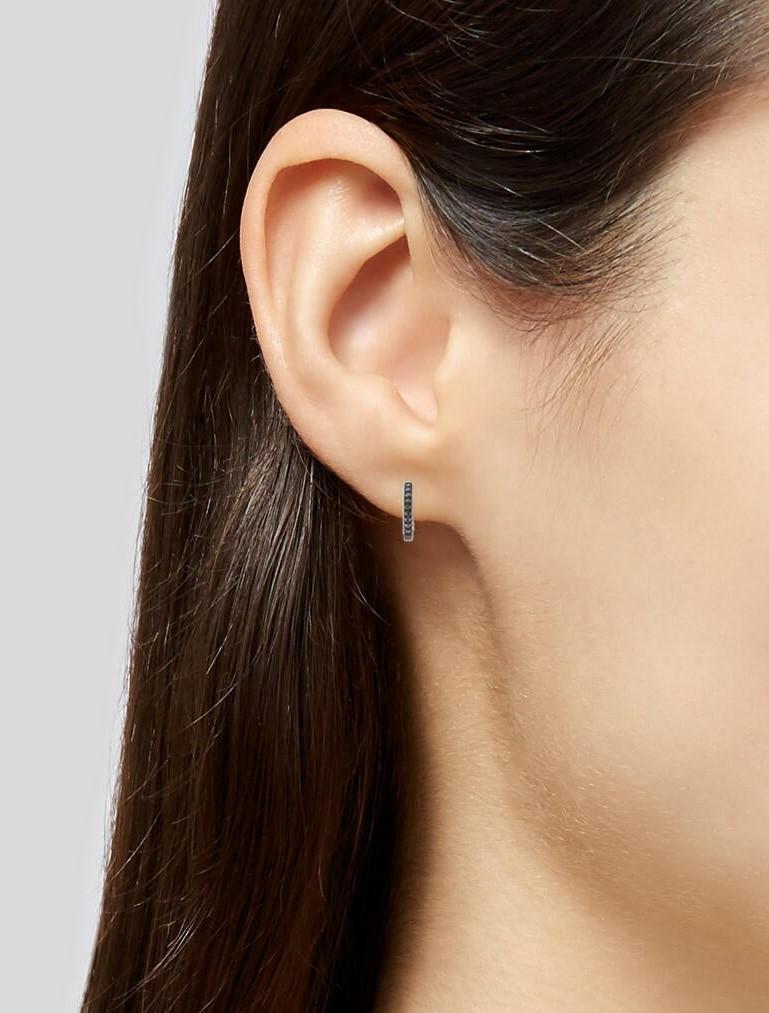 Contemporary 14K Black 0.05ct Diamond Huggie Earrings for Her For Sale