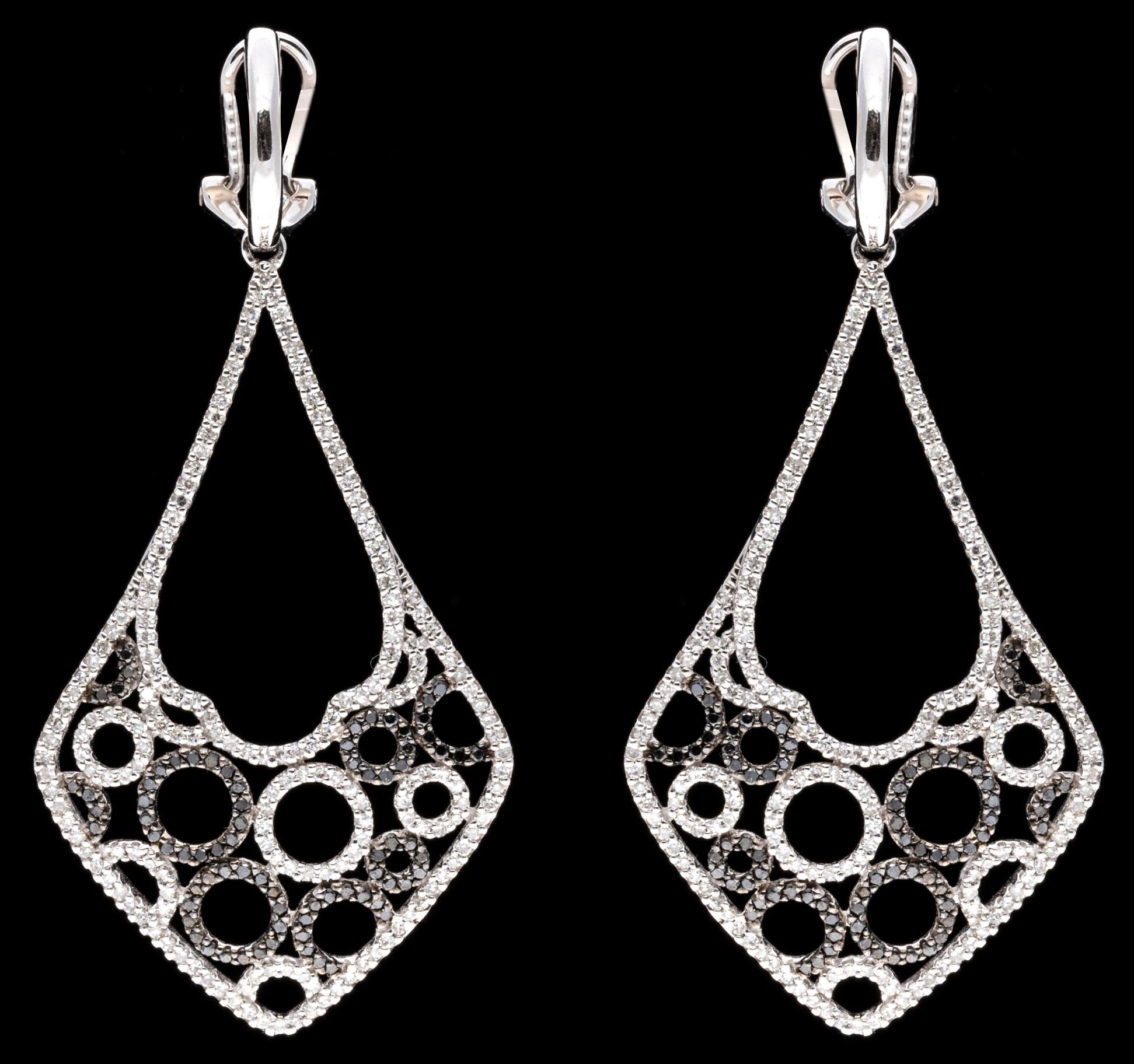 14k white gold earrings. These fabulous, contemporary earrings contain a small high polished half hoop top. Suspended from the hoop is an elongated diamond shaped, open drop style pendant, set with a trim of round faceted white diamonds that outline