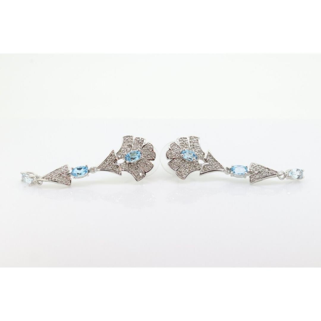Vintage from the 1980s
Materials: Stone
Gemstone: Topaz
Location: Earlobe
Closure: Push back

Style: Mid-century

Spectacular 14k White Gold Chandelier Dangle earrings.

Blue Topaz and Diamond accents.


Condition: Show no signs of
