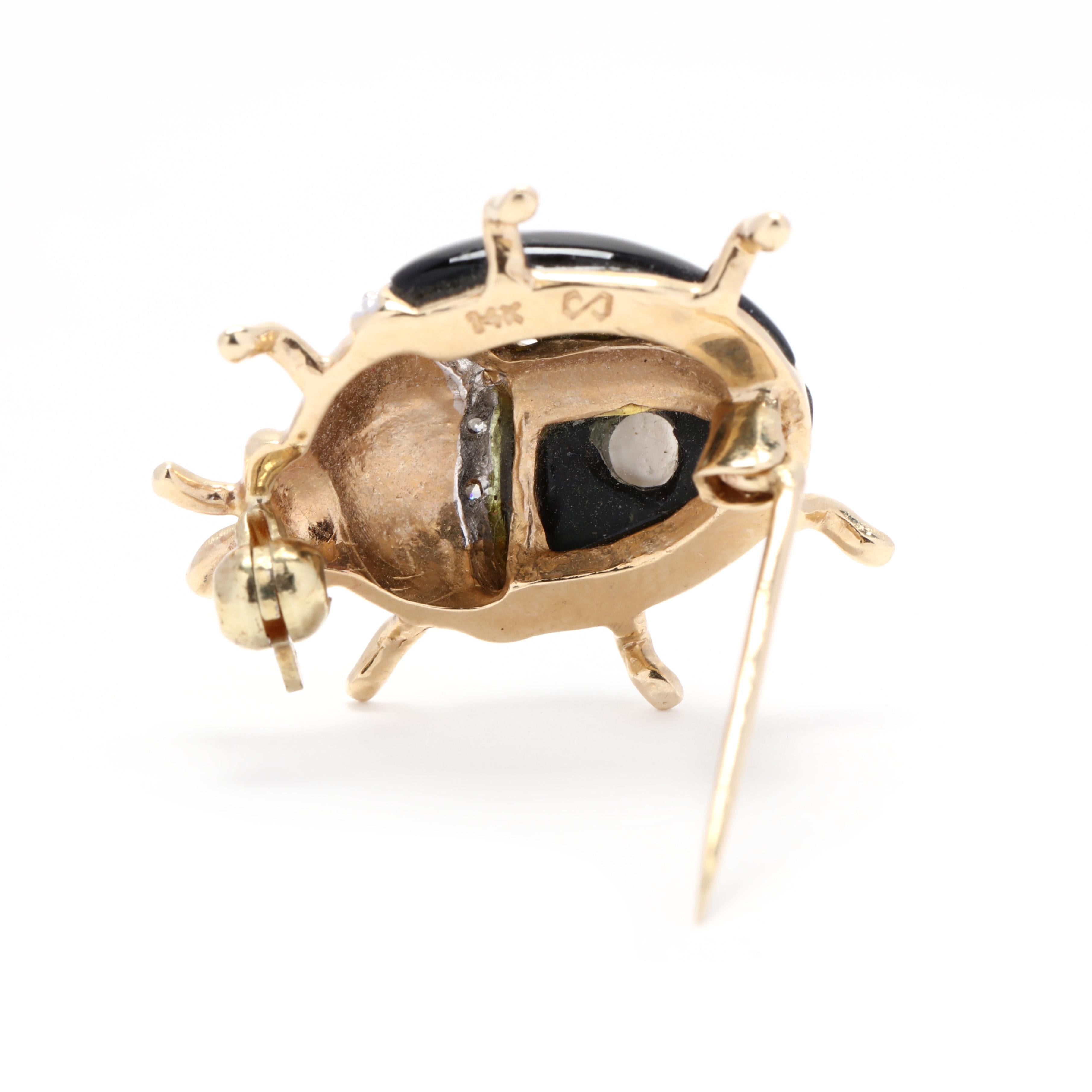 A vintage 14 karat yellow gold mother of pearl, black onyx and diamond ladybug brooch. This brooch features a lady bug motif with a spotted black onyx and mother of pearl inlay body and with diamond accents.



Stones:

- black onyx

- mother of