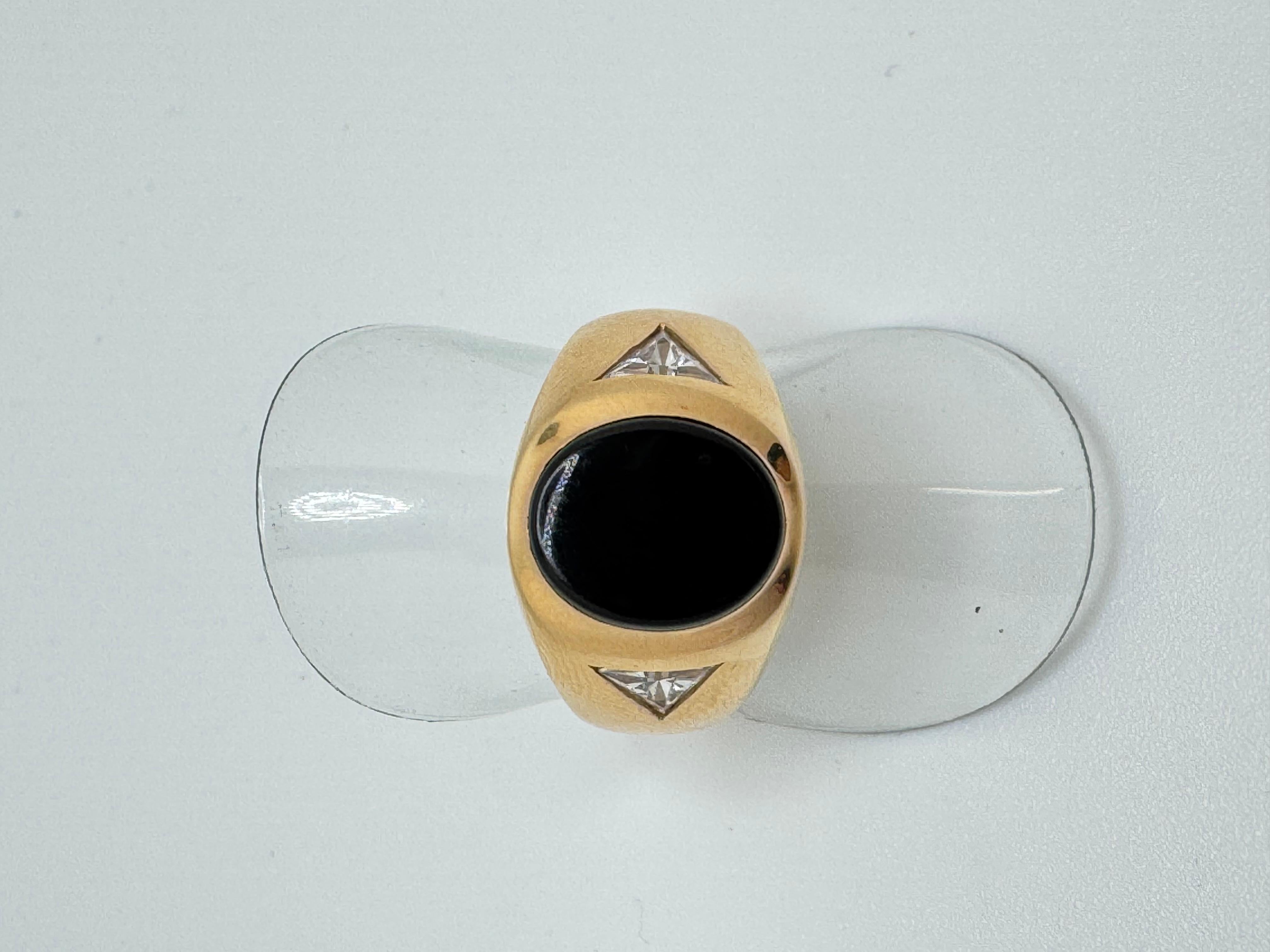 This bold men’s ring is crafted in 14K yellow gold and features a striking 7.3mm round rhodolite garnet, weighing approximately 2.0 carats. The rich, deep reddish-purple gemstone is securely bezel set, offering a sleek and modern look while