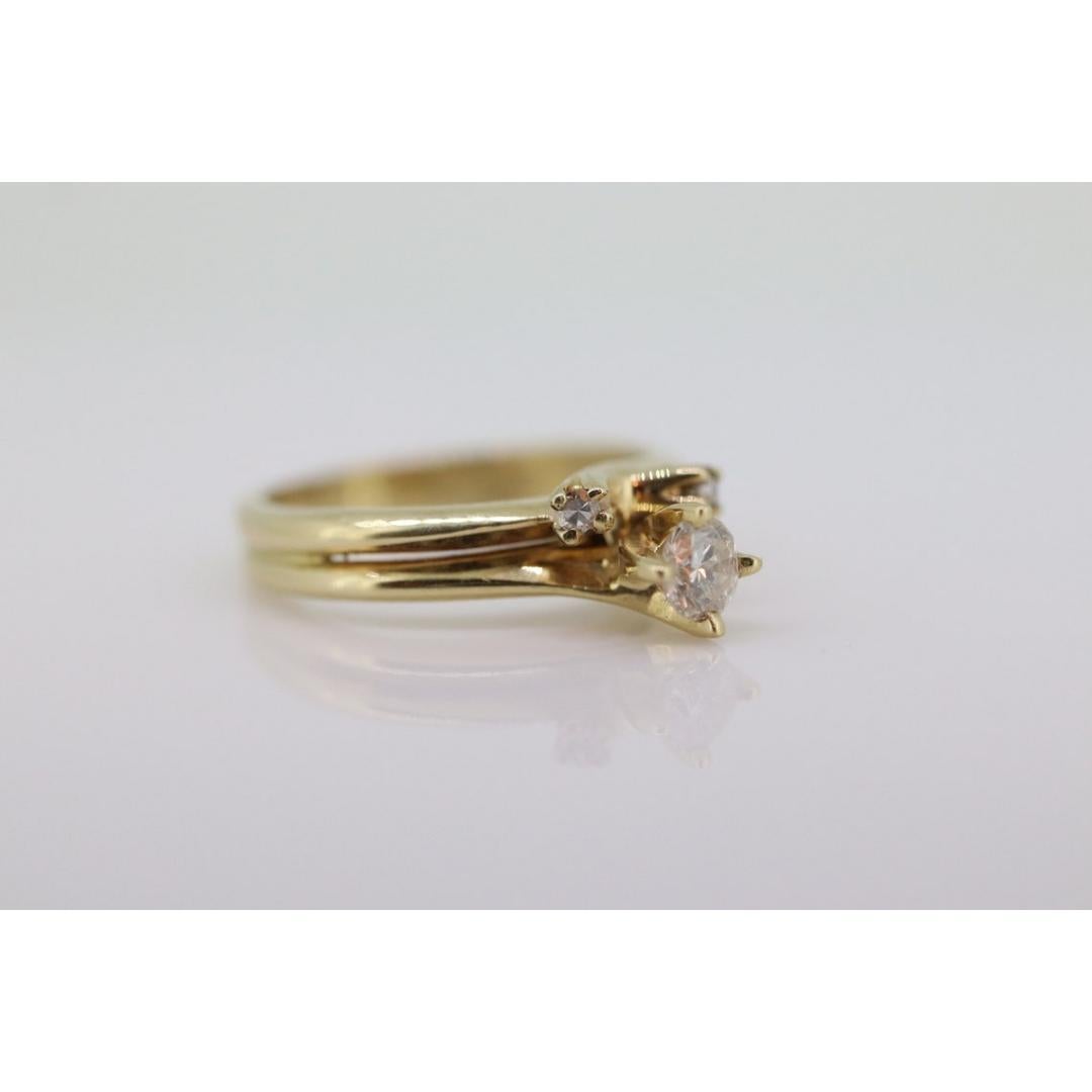 Vintage from before 2000
Size: 4 US
Materials: Gold
Gemstone: Diamond
Gem Color: Colorless

Band Color: White

Beautiful double solitaire set ring. Very petite and dainty design.

14k Polished Yellow Gold. Rings soldered at shank but can be easily